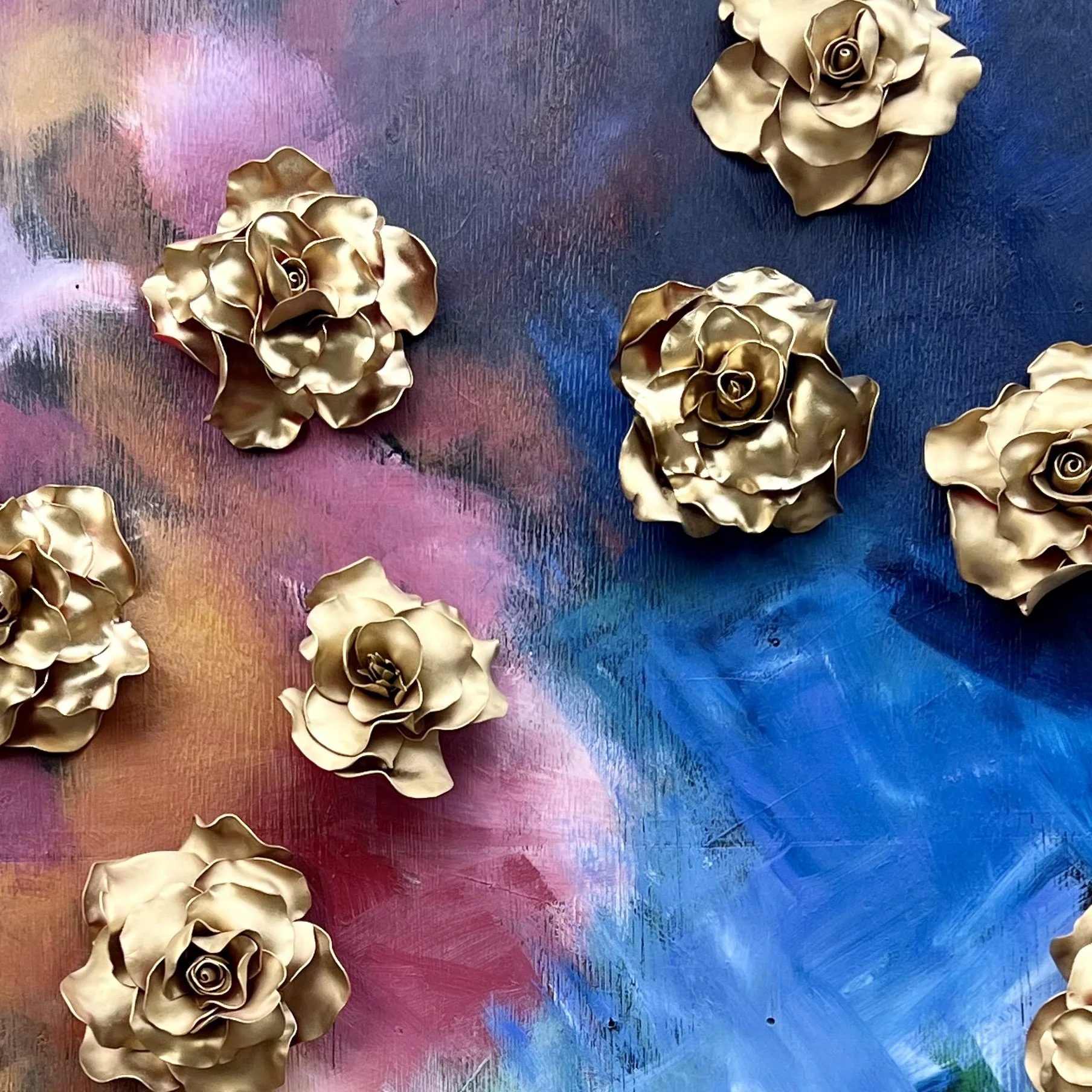 photo wall with giant gold faux roses