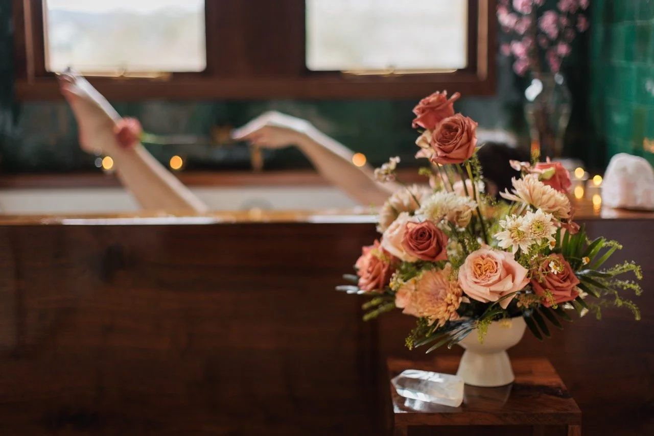 spa day with a rose and chrysanthemum arragement