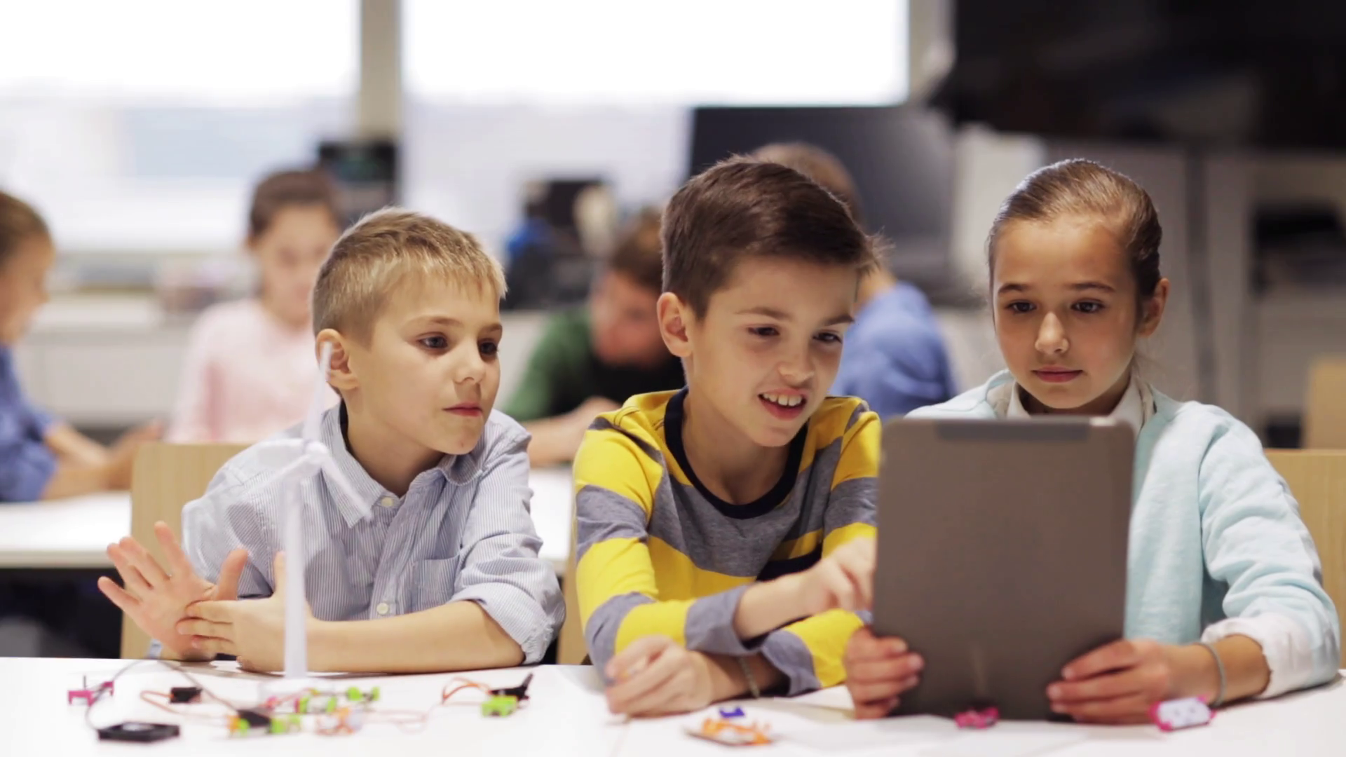 education-science-technology-children-and-people-concept-group-of-smiling-kids-or-students-with-tablet-pc-computer-programming-electric-windmill-toy-at-robotics-school-lesson_ru6hd2s7e_thumbnail-full01.png