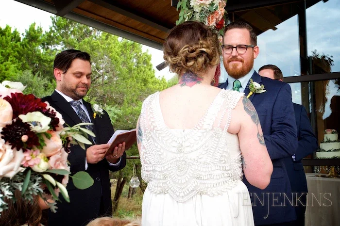 Textured messy bridal updo with loose face-framing pieces