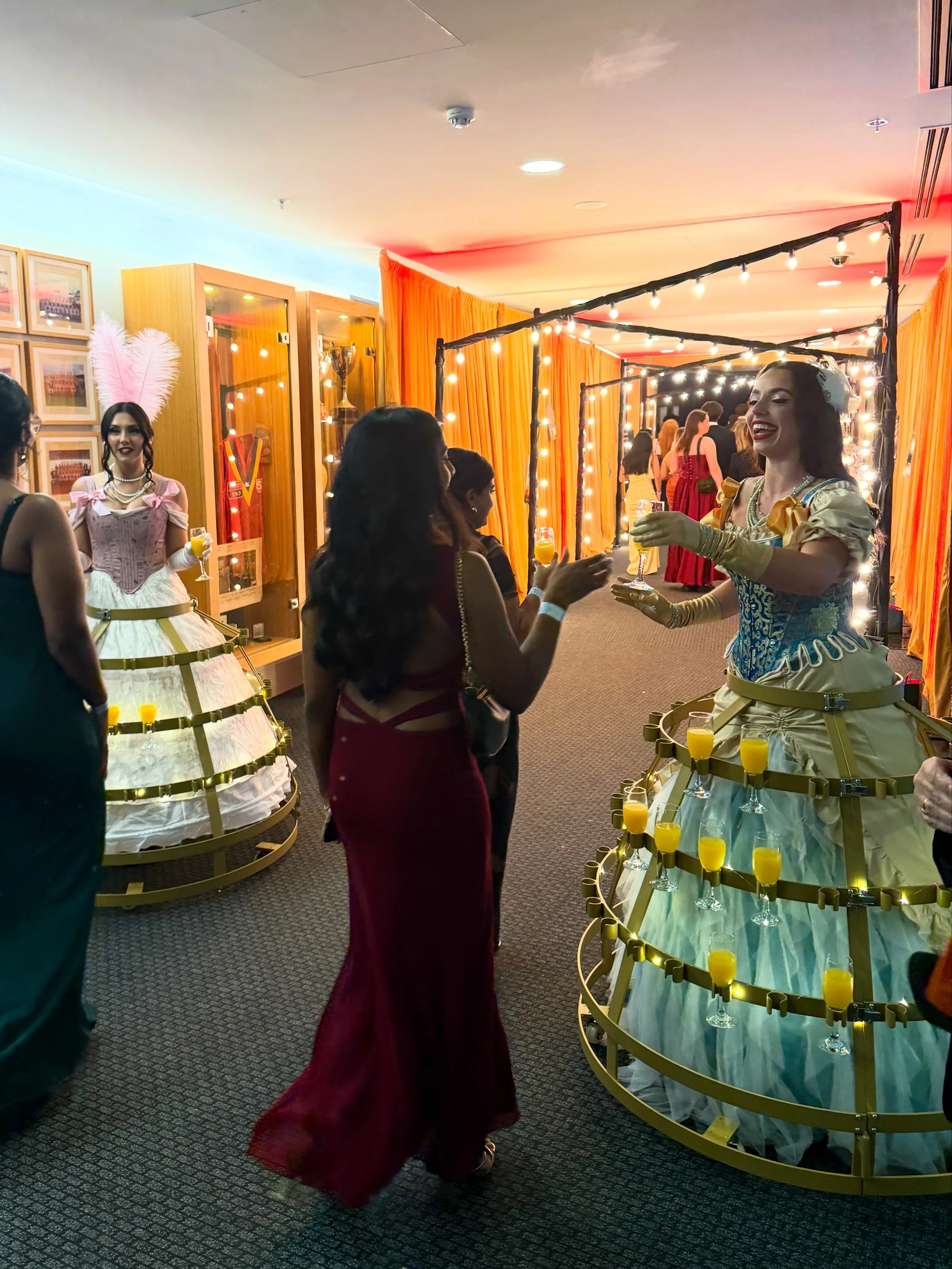Champagne Models serving guests