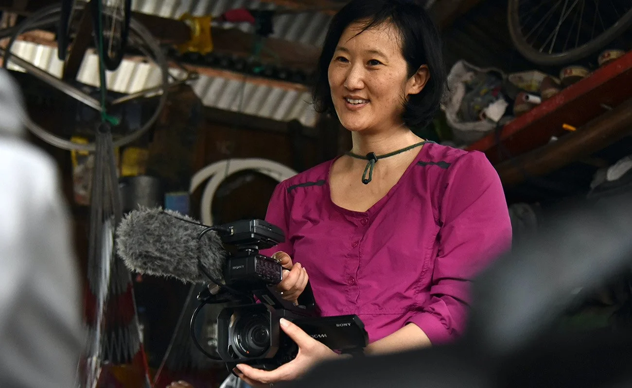 cinematographer holding camera
