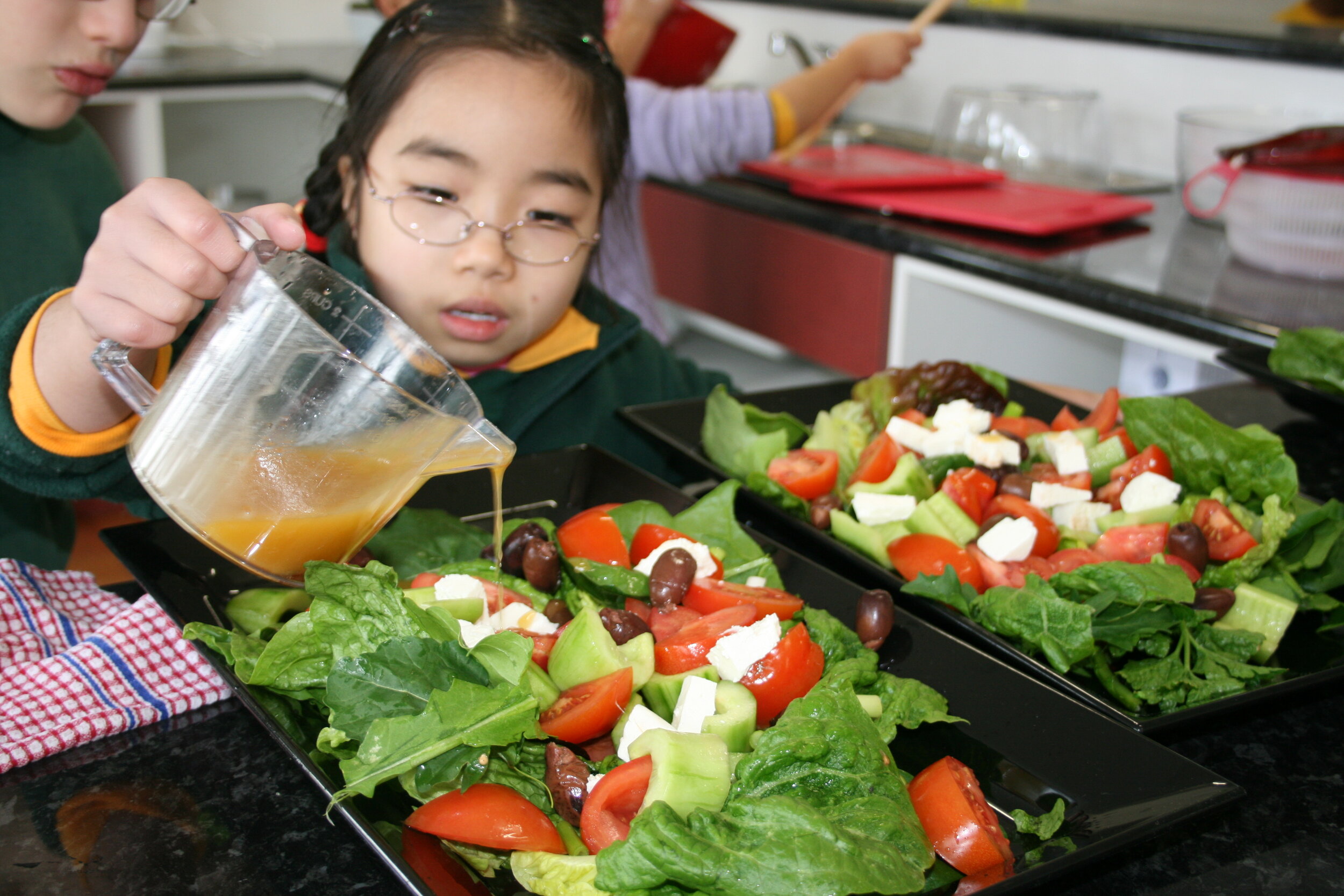 Sunshine North Primary_kitchen_children_cooking_salads_lettuces_olives_tomatoes_dressing_October 2007_GFYL1_HR_1.JPG
