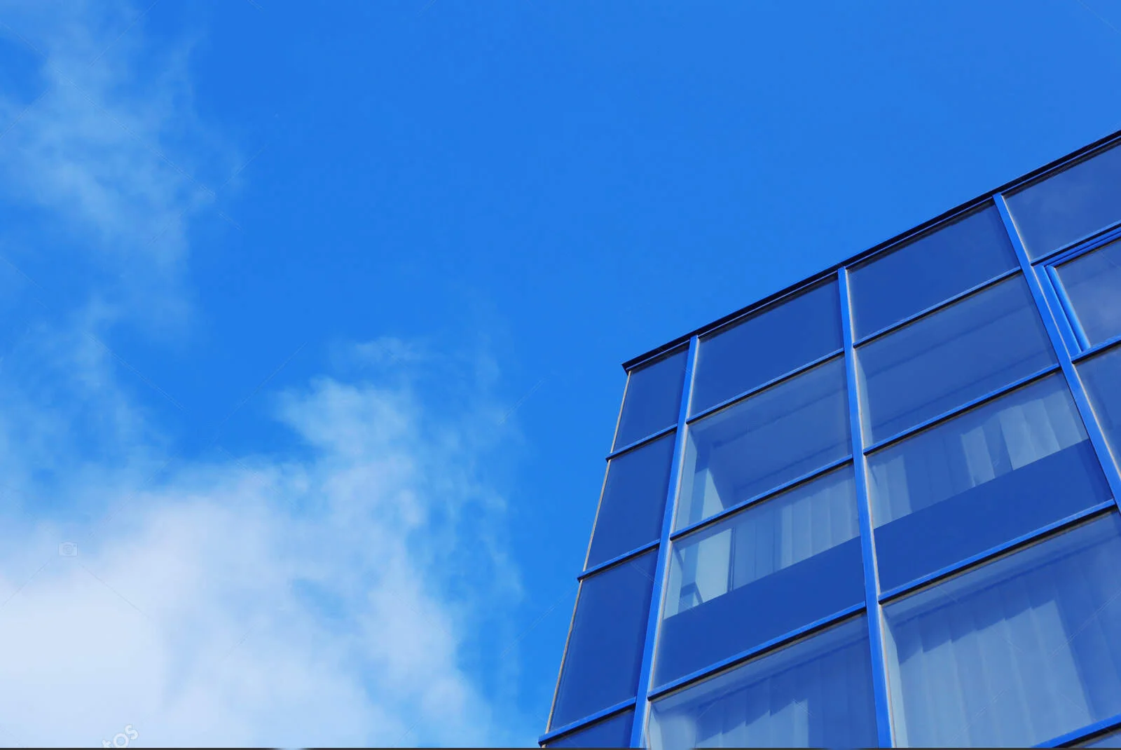 depositphotos_237283598-stock-photo-modern-office-building-tinted-windows.jpg