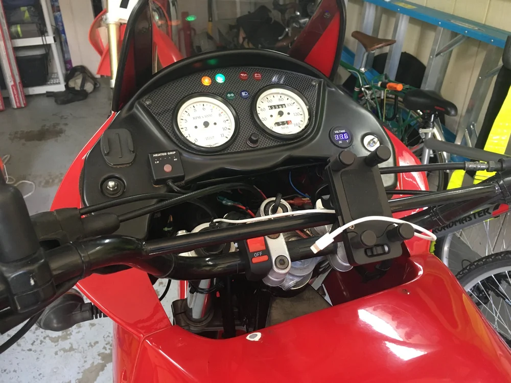  Heated grips, light switch gear, voltage meter, phone mount, USB charge cable.  