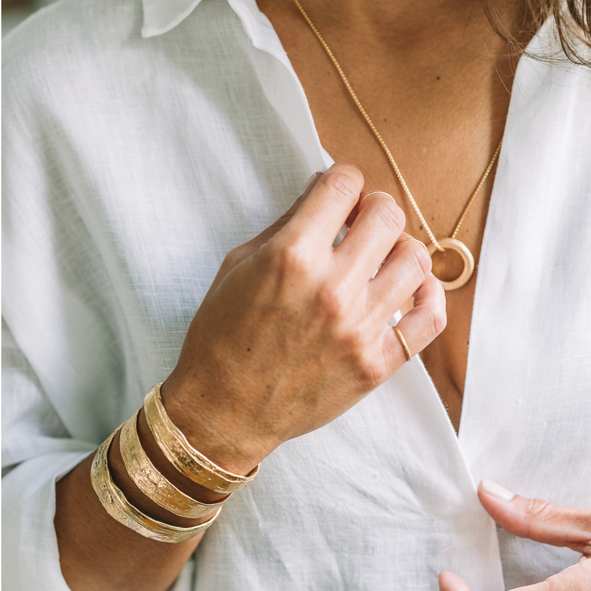 woman in white, gold jewelry, sustainable jewellery, Katie G. Jewellery
