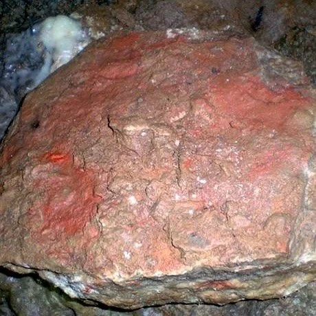 Paleolithic Palette? &mdash;
Red ochre on a portable stone.

Encountering this stone while exploring the cave of La Pasiega was quite eerie.

The blotches of pigment on the stone looked quite fresh and wet.  There are red dots/marks on the side of it