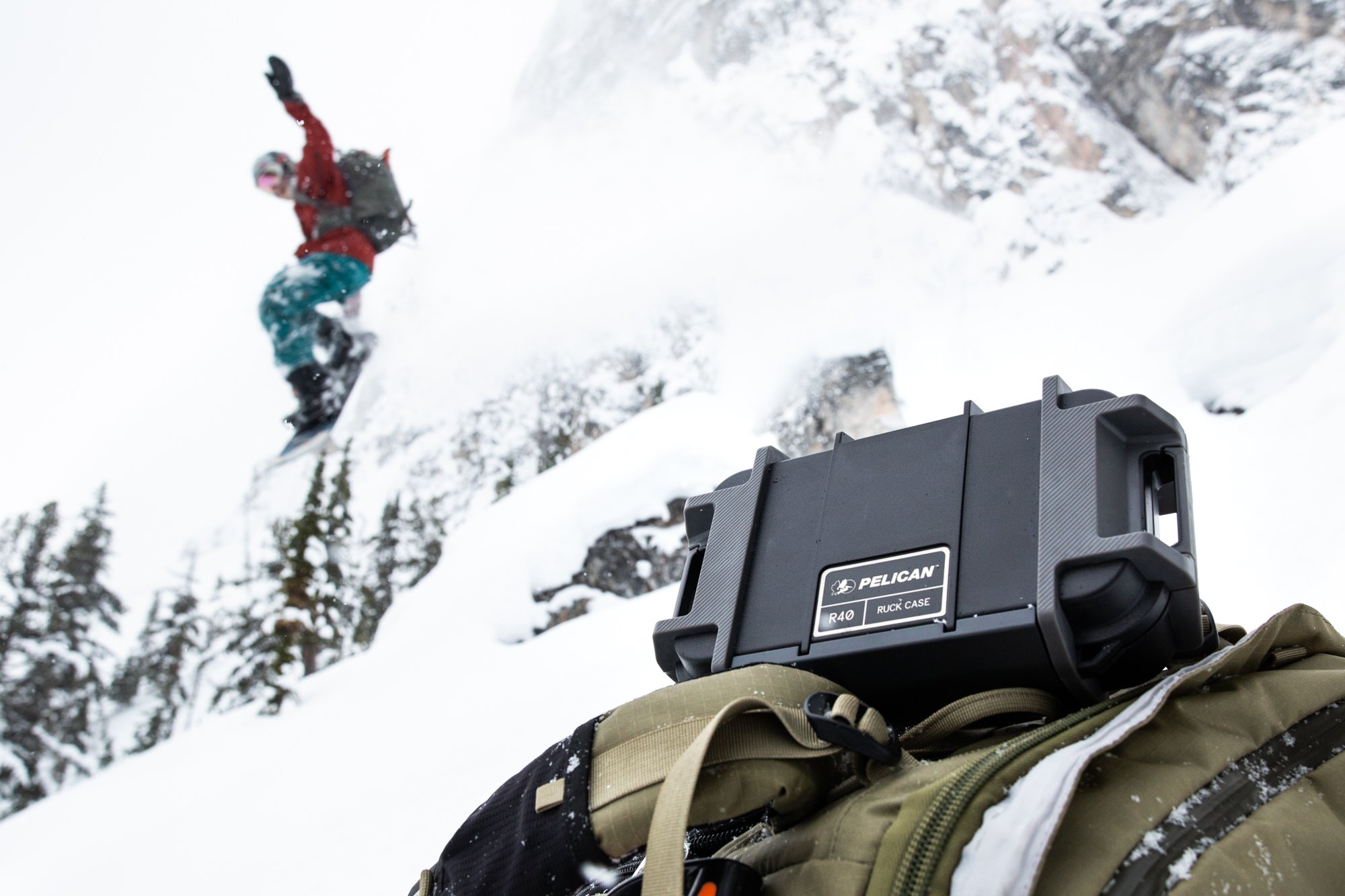 SNOWBOARDER IN THE WINTER WITH A PRODUCT IN THE FOREGROUND