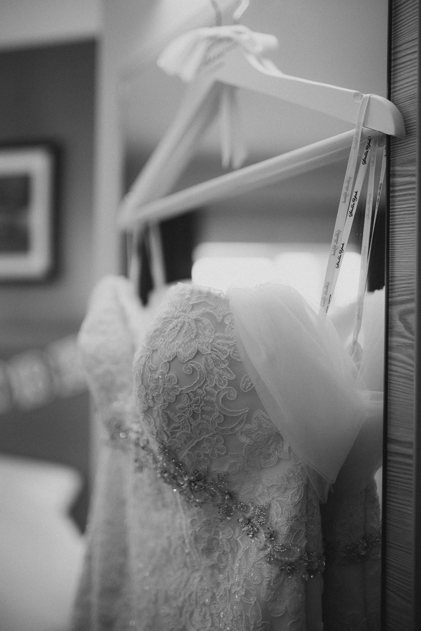 Wedding dress hung up on a hanger
