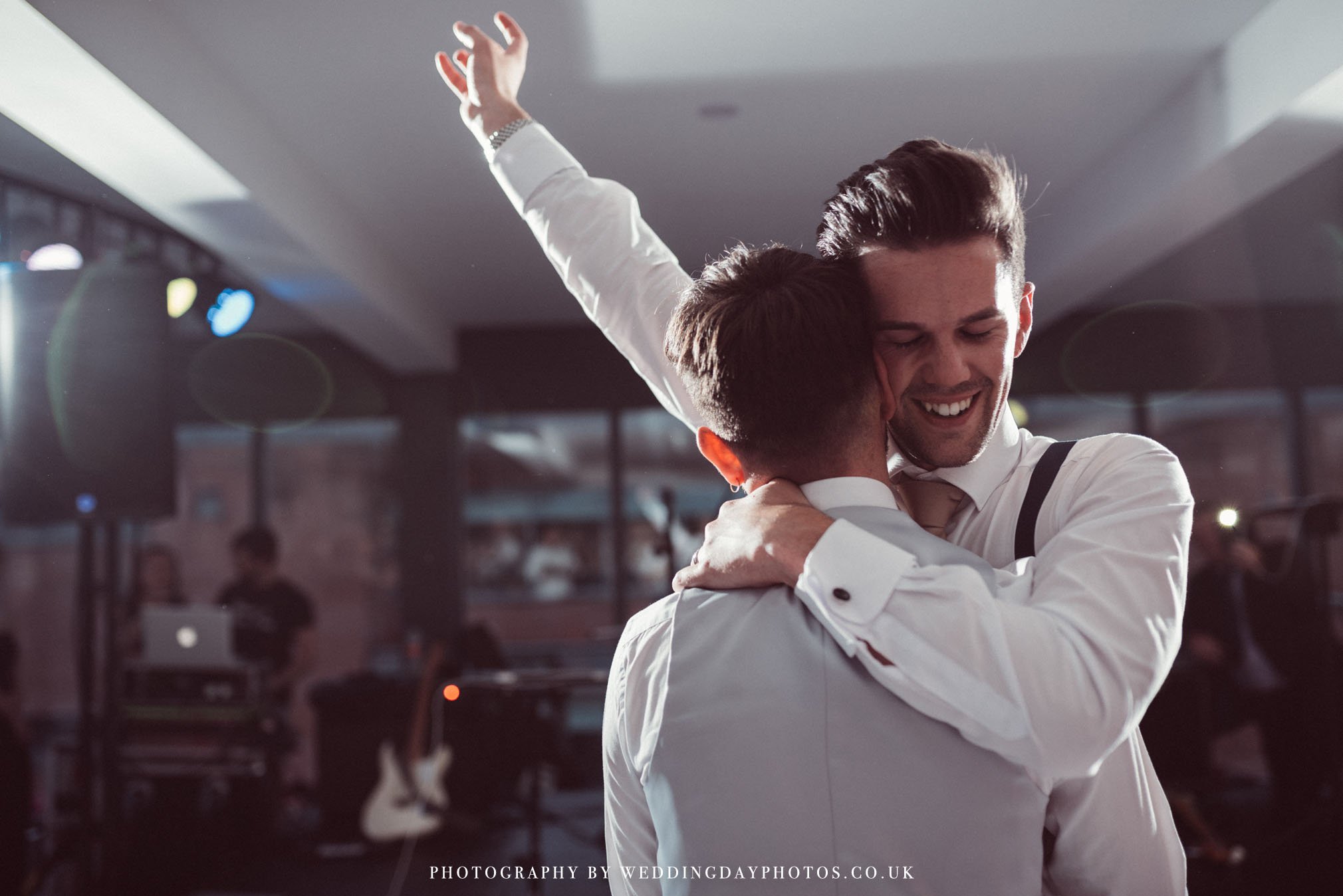 excited newlywed couple dancing at manchester hall