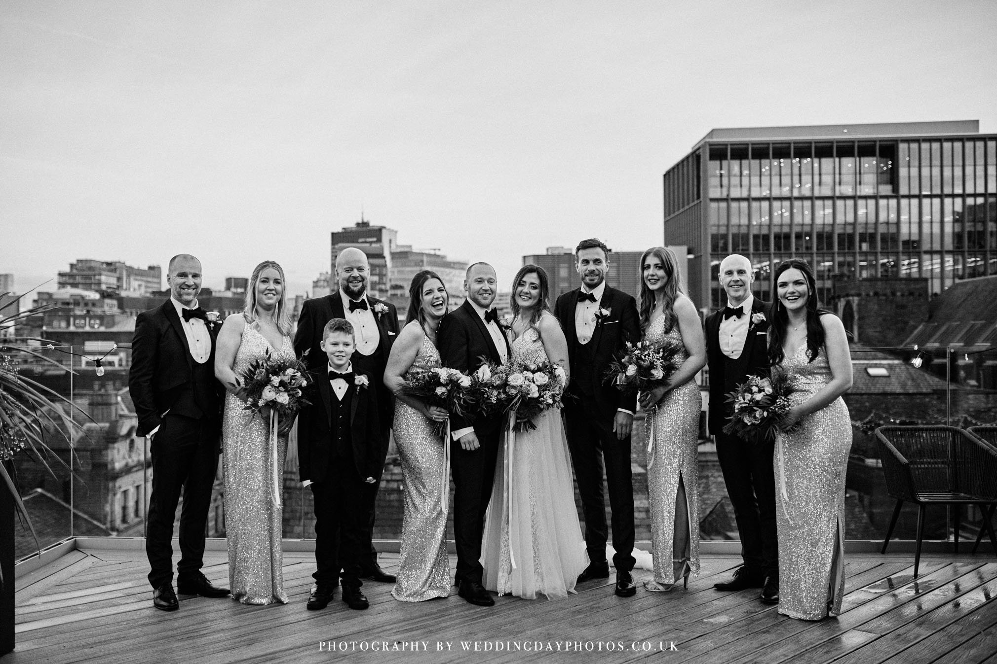 photo of the bridal party on John Rylands rooftop terrace, manchester hall