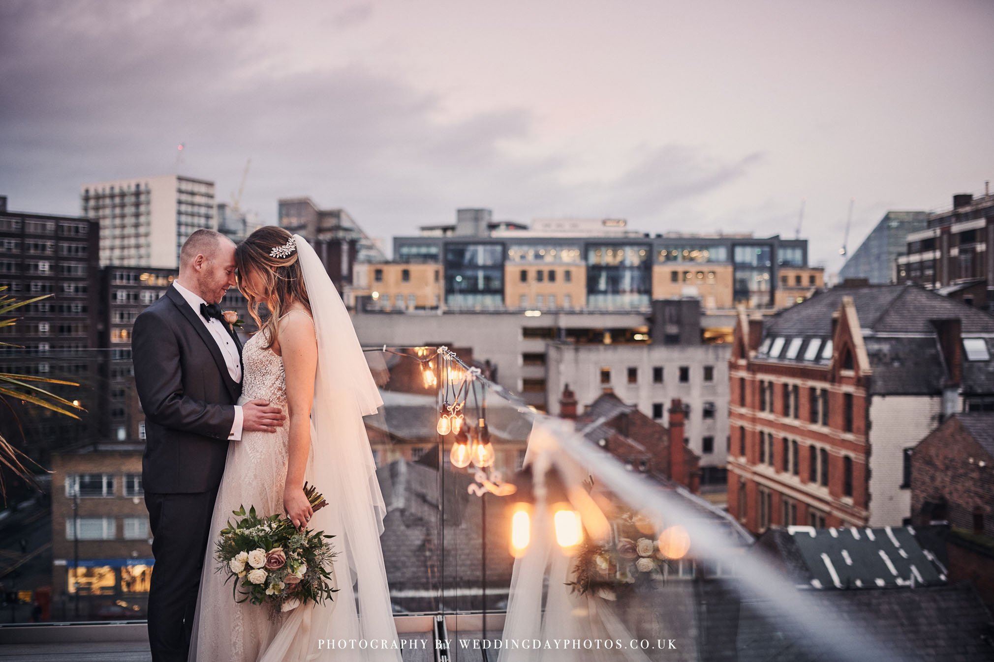 wedding couple portrait on John Rylands rooftop terrace, manchester hall