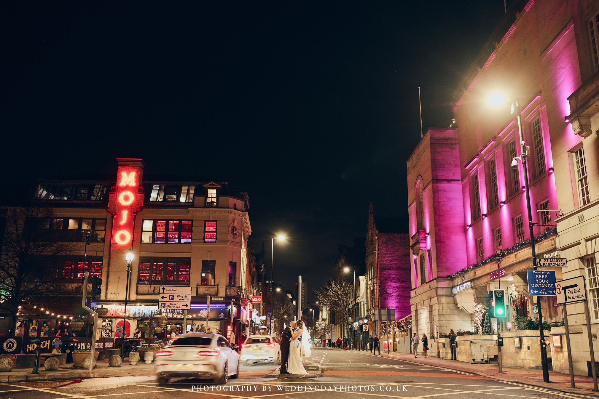 dramatic street wedding portrait outside manchester hall