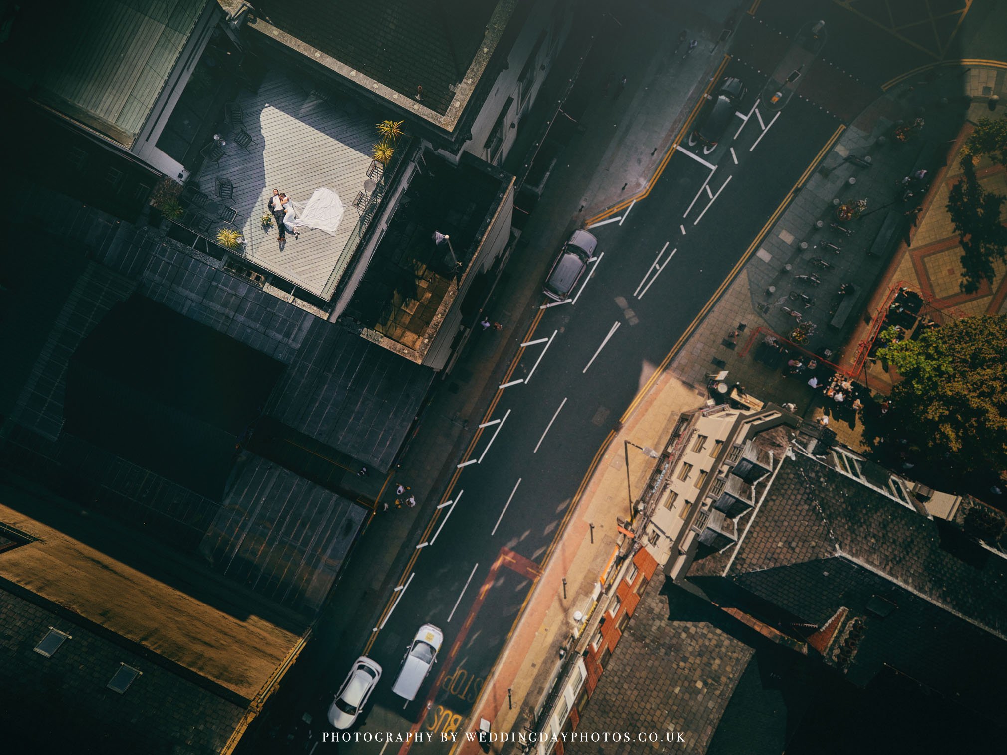 spectacular view of wedding couple over manchester hall photographed from a drone