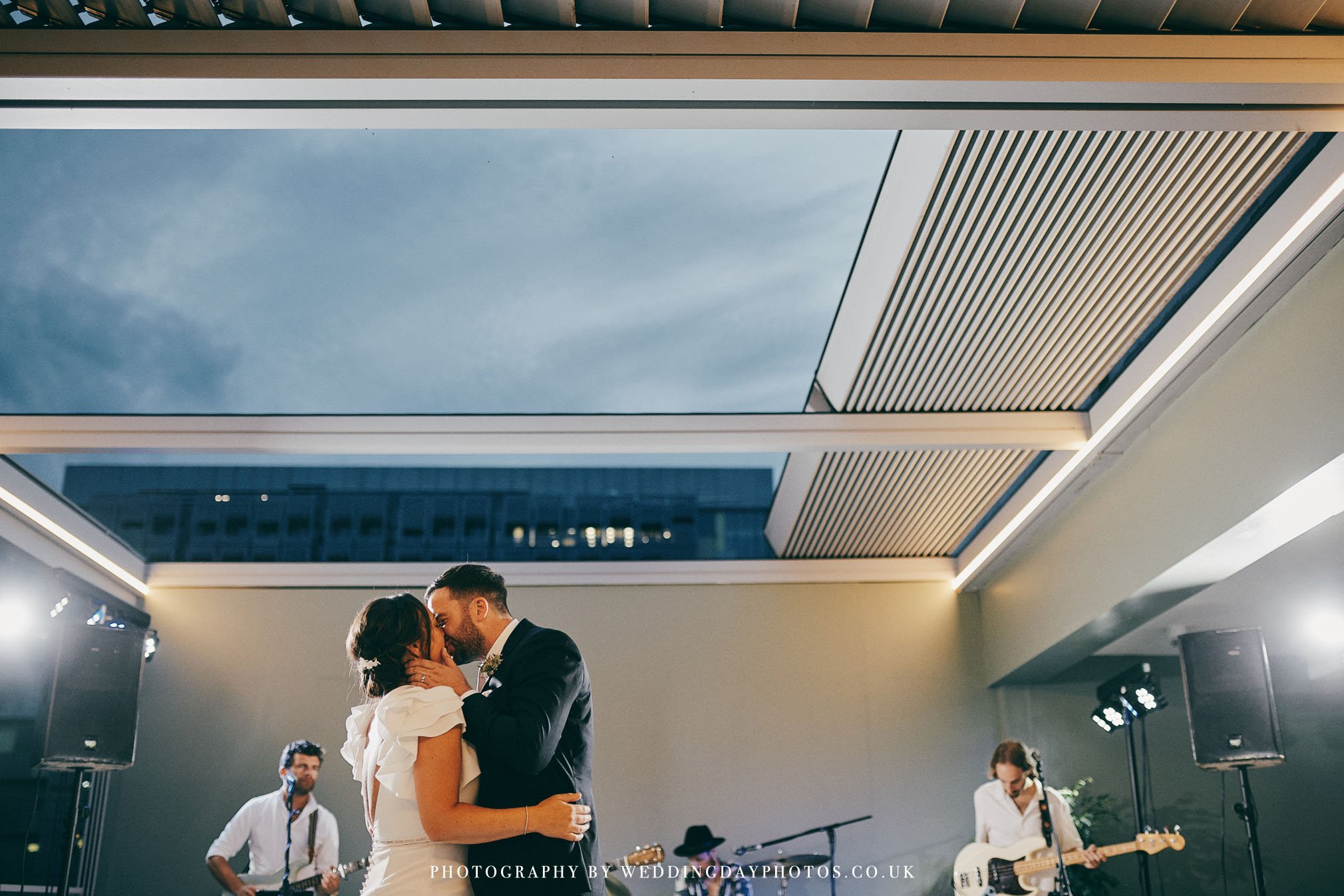 wedding first dance underneath open rooftop at manchester hall