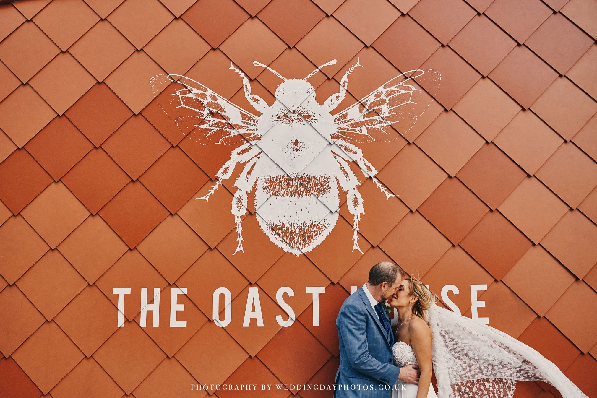 cool wedding couple outside oast house near manchester hall