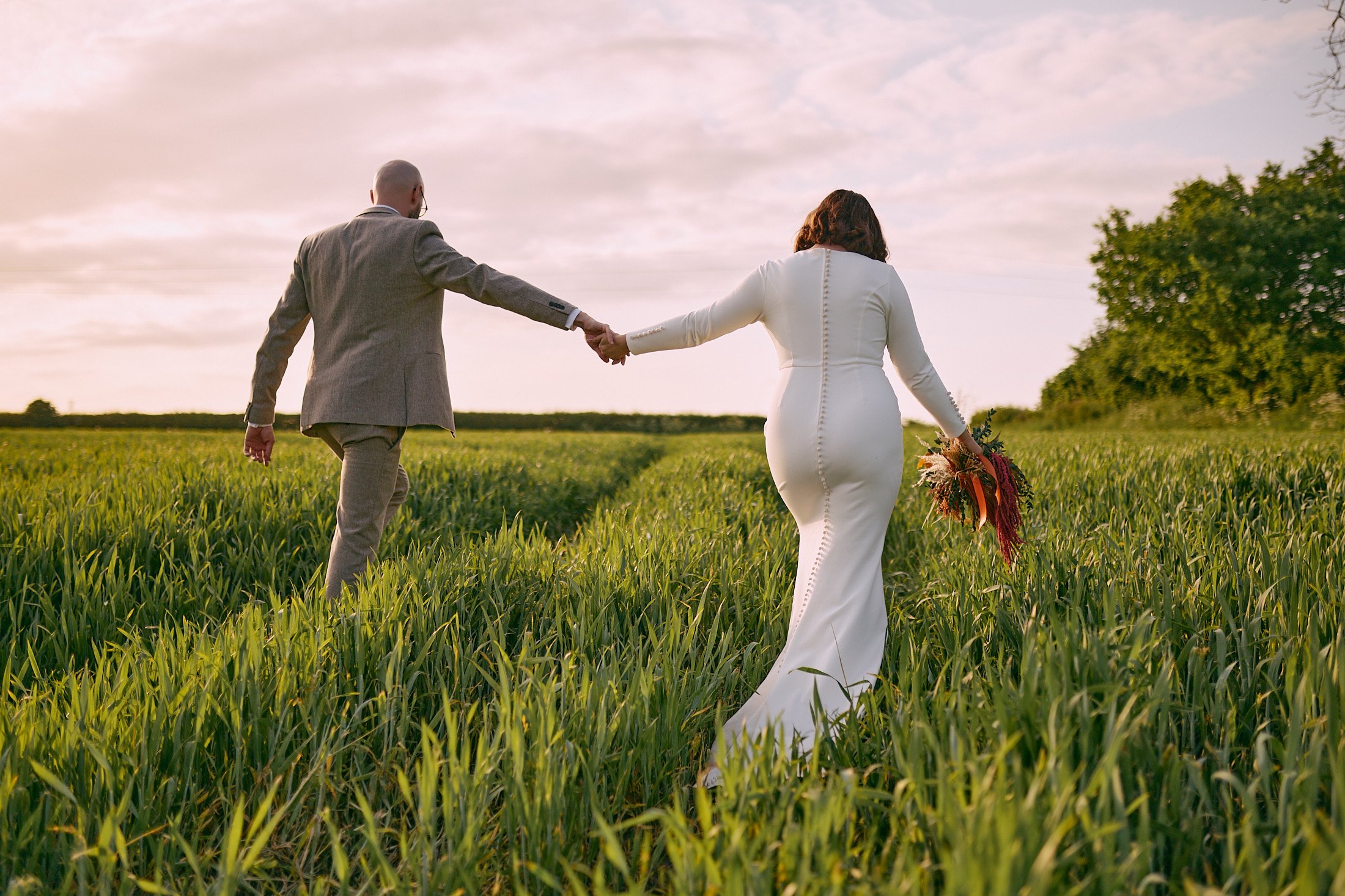 romantic couple portrait in a field at sunset near Larkspur Lodge