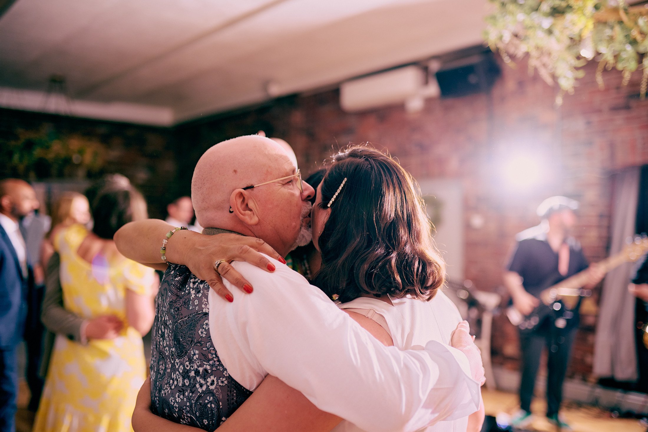 bride and father embrace on dance floor at Larkspur Lodge