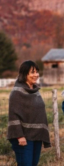 Woman On Farm In Wool Poncho