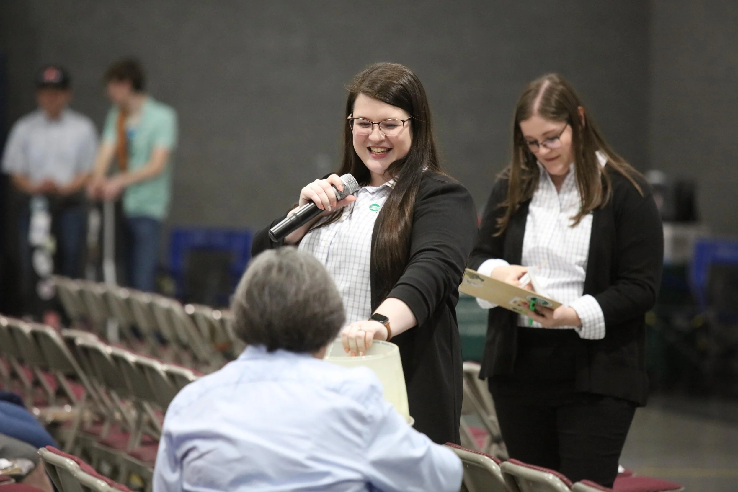 Two employees at 2025 Annual Meeting