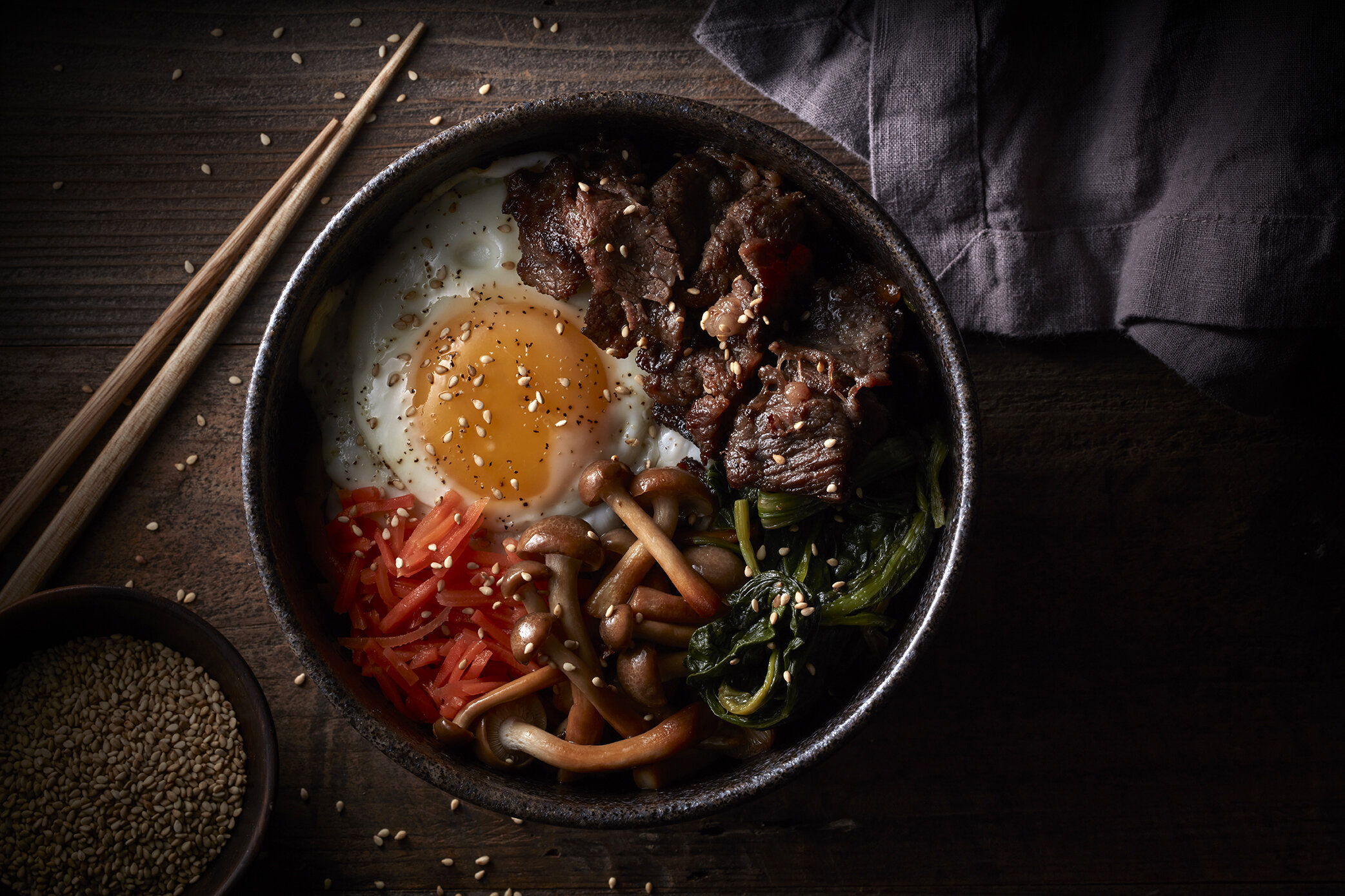 Ramen beef bowl with fried egg.