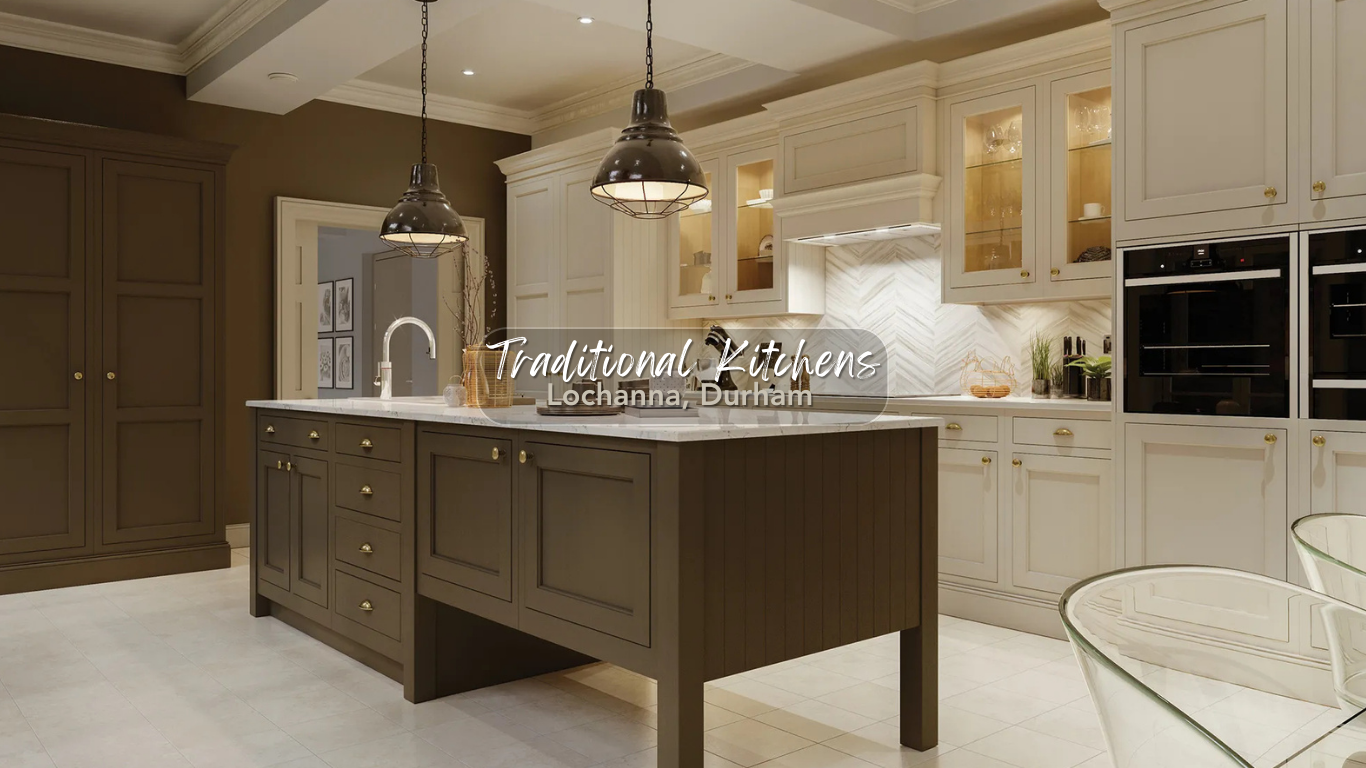 A spacious traditional kitchen with white cabinetry, a dark island, pendant lighting, and built-in ovens.