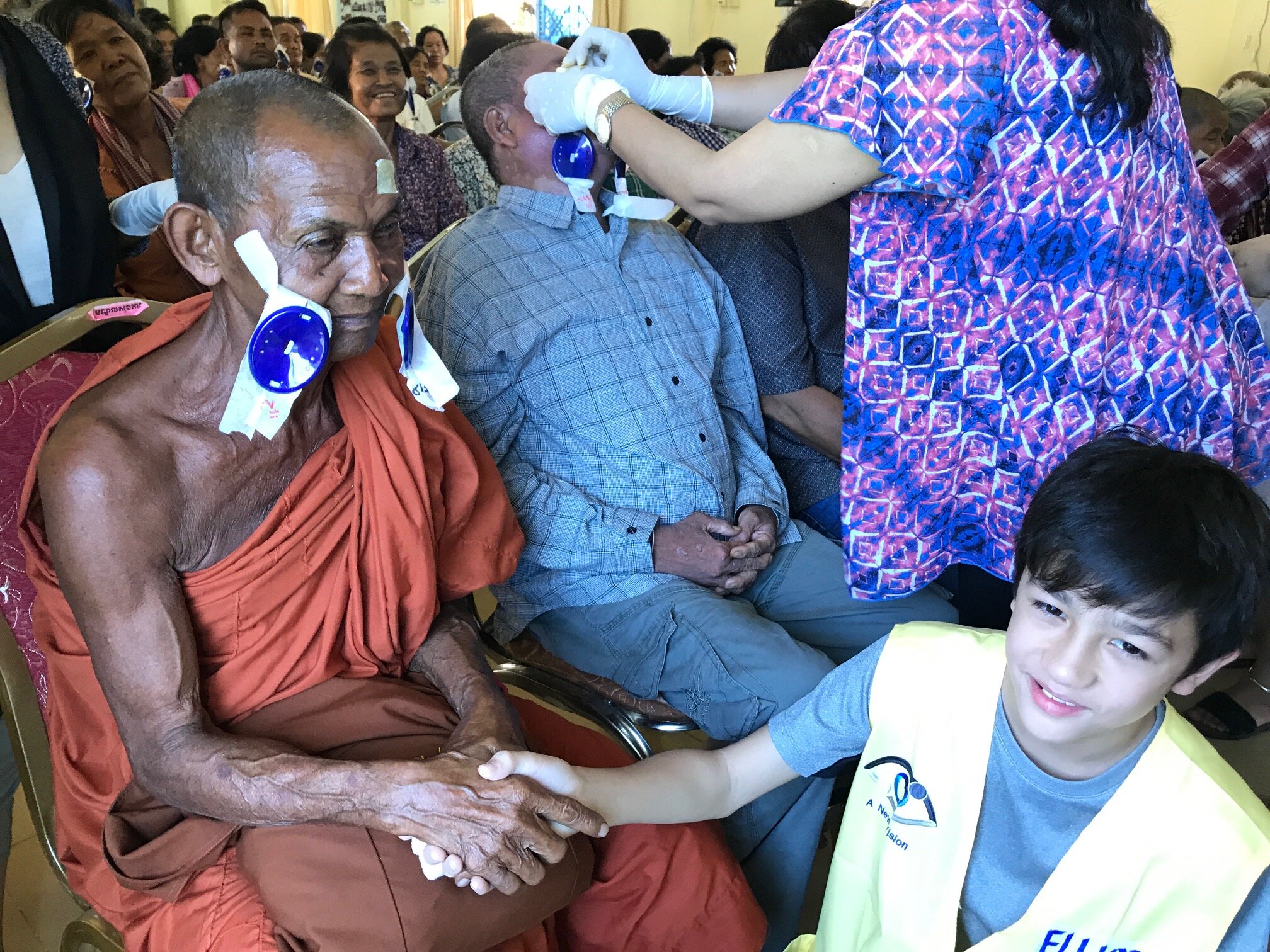 WAH Cambodia Cataract Mission with Ambasador Elliott and Monk patient.JPG