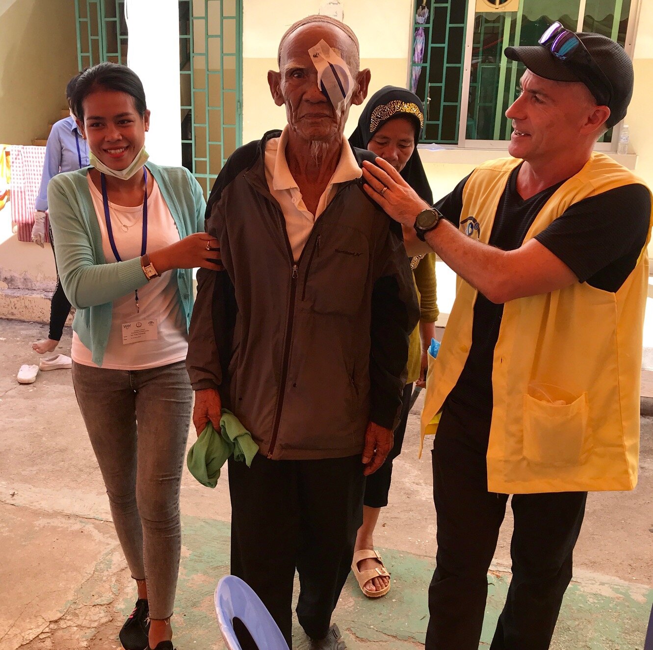 WAH Cambodia Cataract Mission CEO Philip Kitcher with patient.JPG