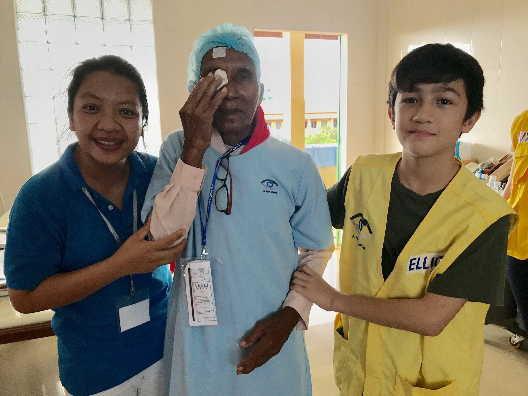WAH Cambodia Cataract Dr Rany with patient and young ambassador Elliott.jpg
