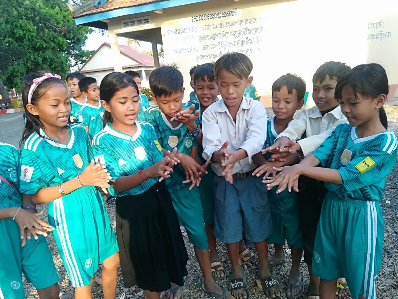WAH Cambodia Covid hand washing children.JPG