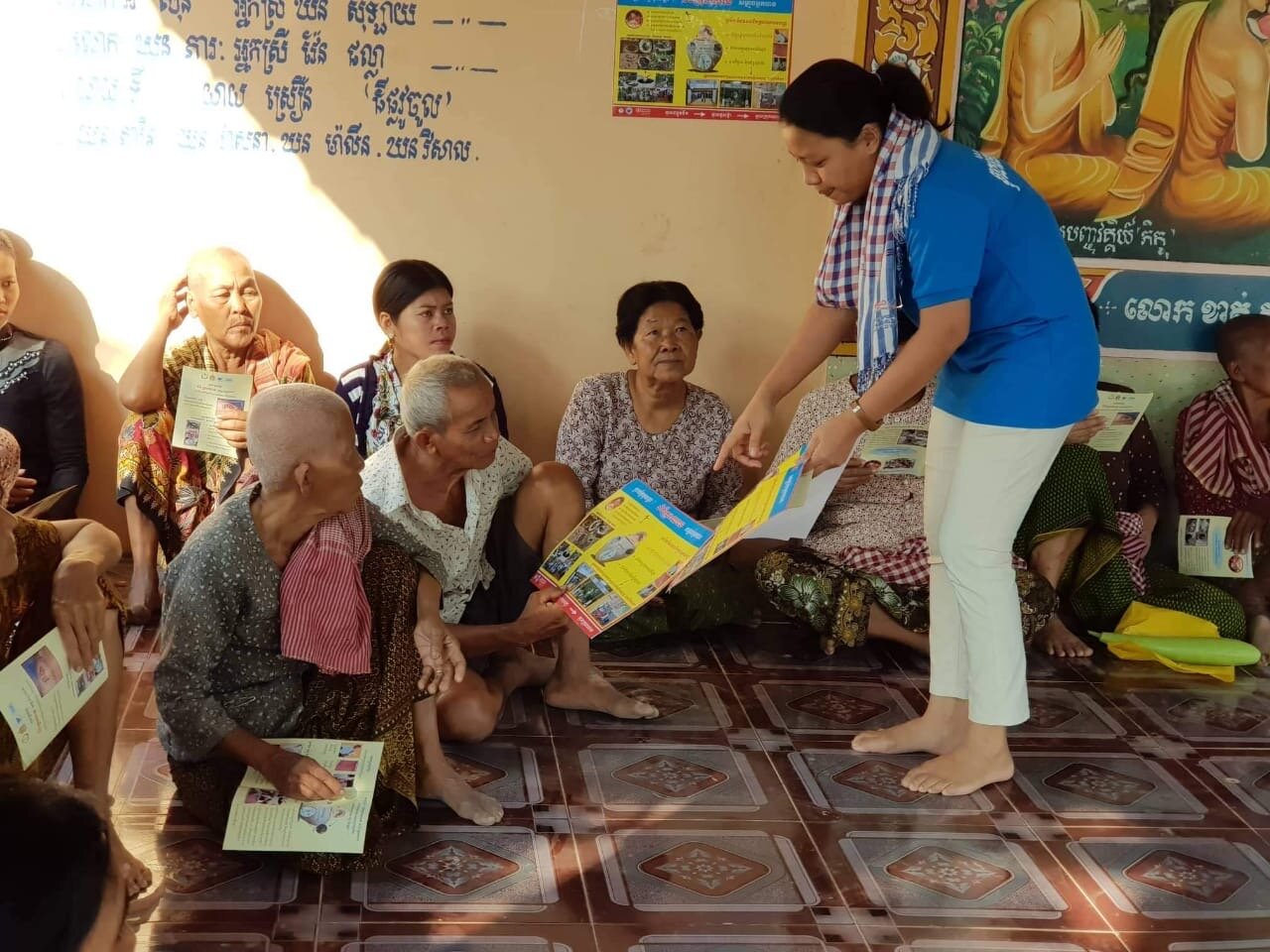 WAH Cambodia Dengue Dr Rany teaching villagers.JPG