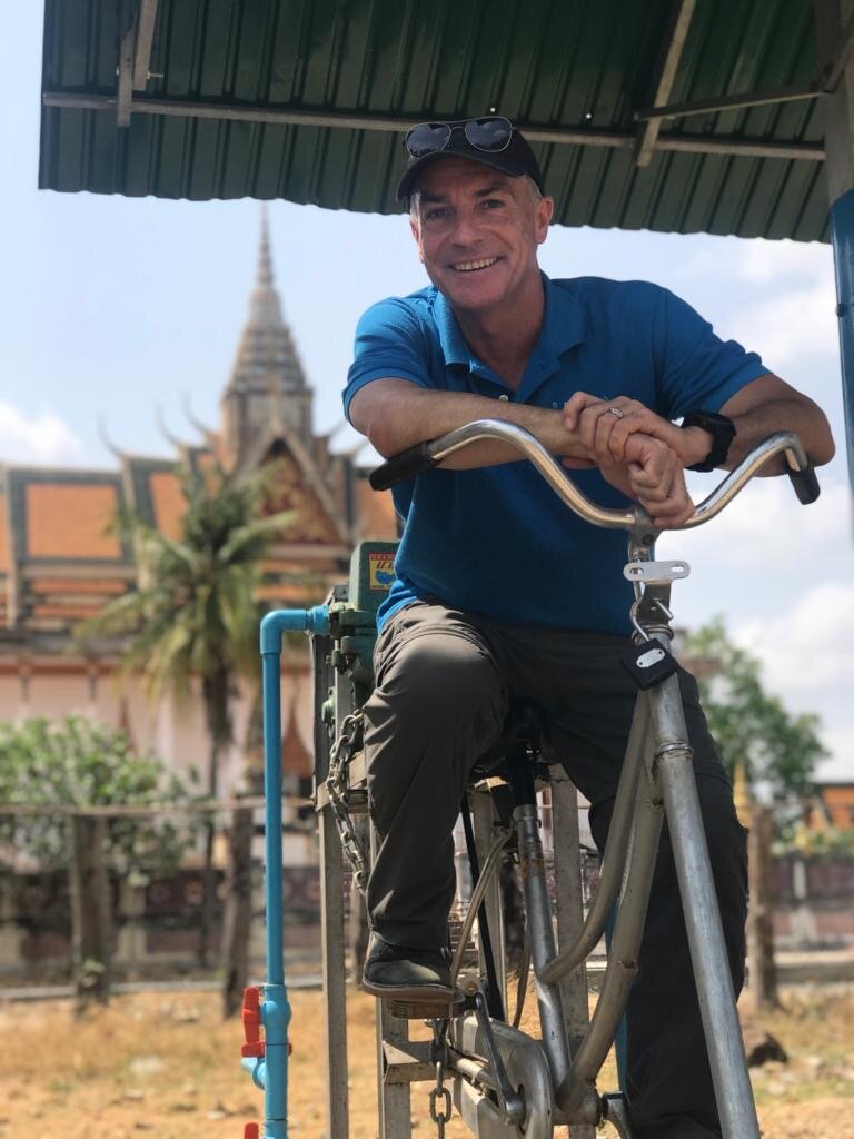 WAH CEO Clean water bicycle pump system Cambodia.JPG