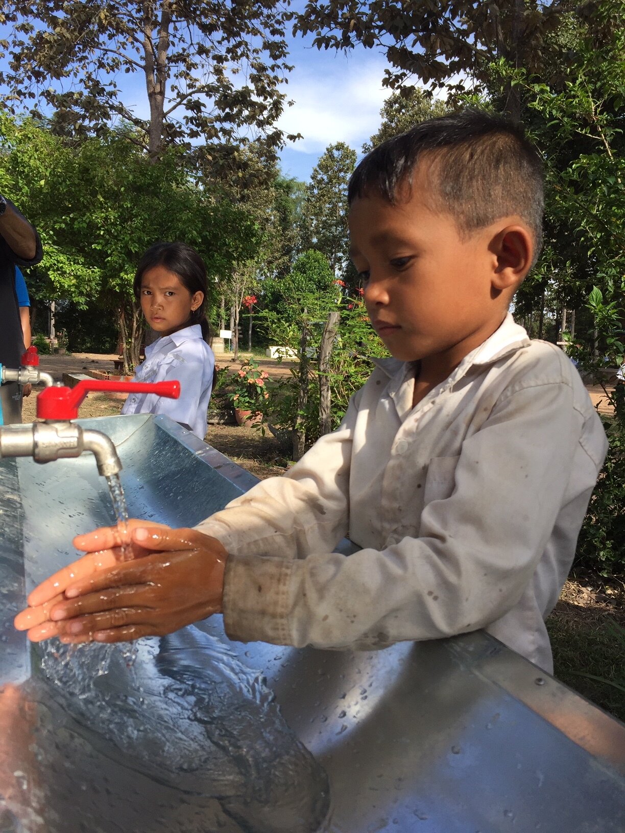 WAH Cambodia kids hand washing.JPG