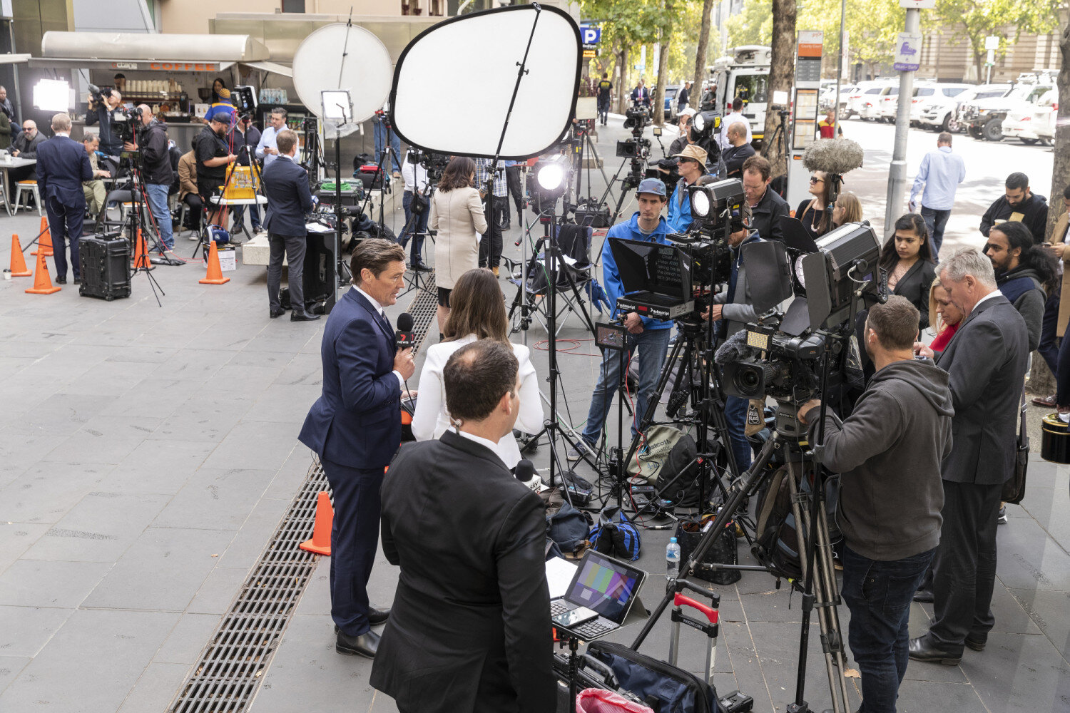 The pavement outside court is filled with local and international reporters and camera crews (Image: AAP)