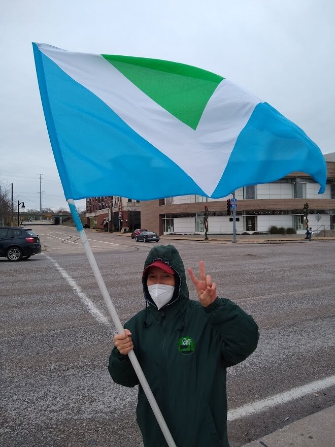 Leah waving the vegan flag.jpg