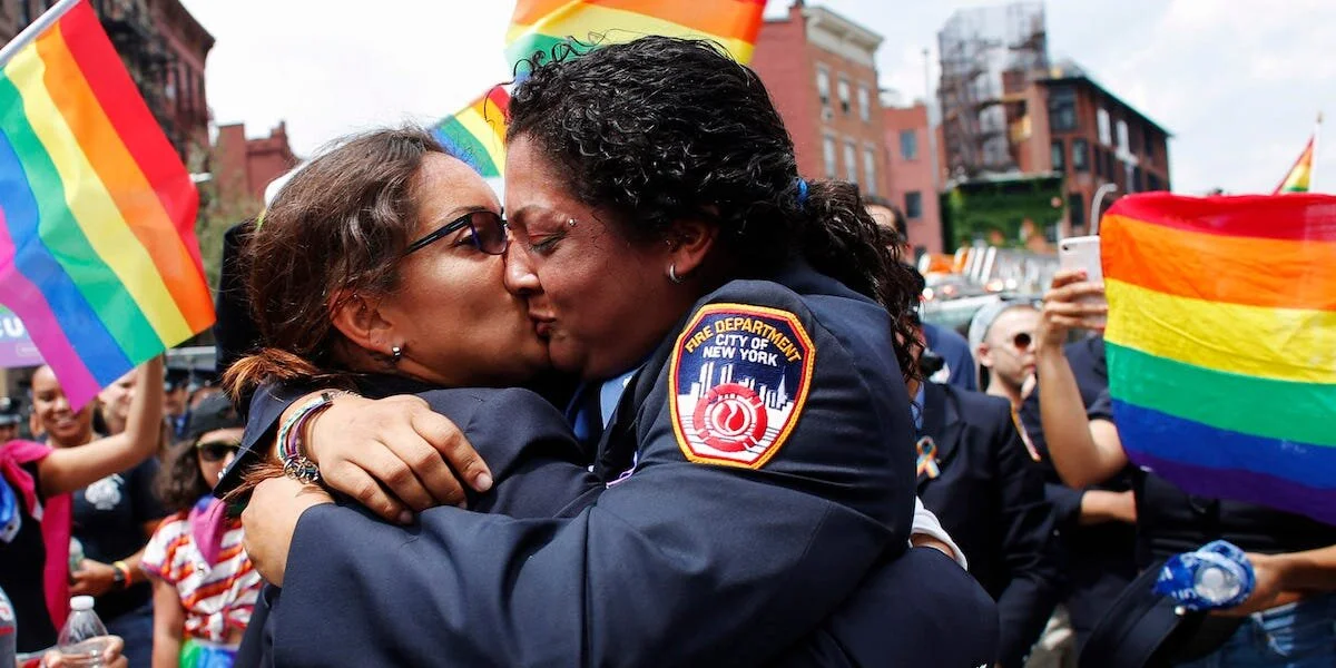 Two women kissing at a Gay Pride event in New York City