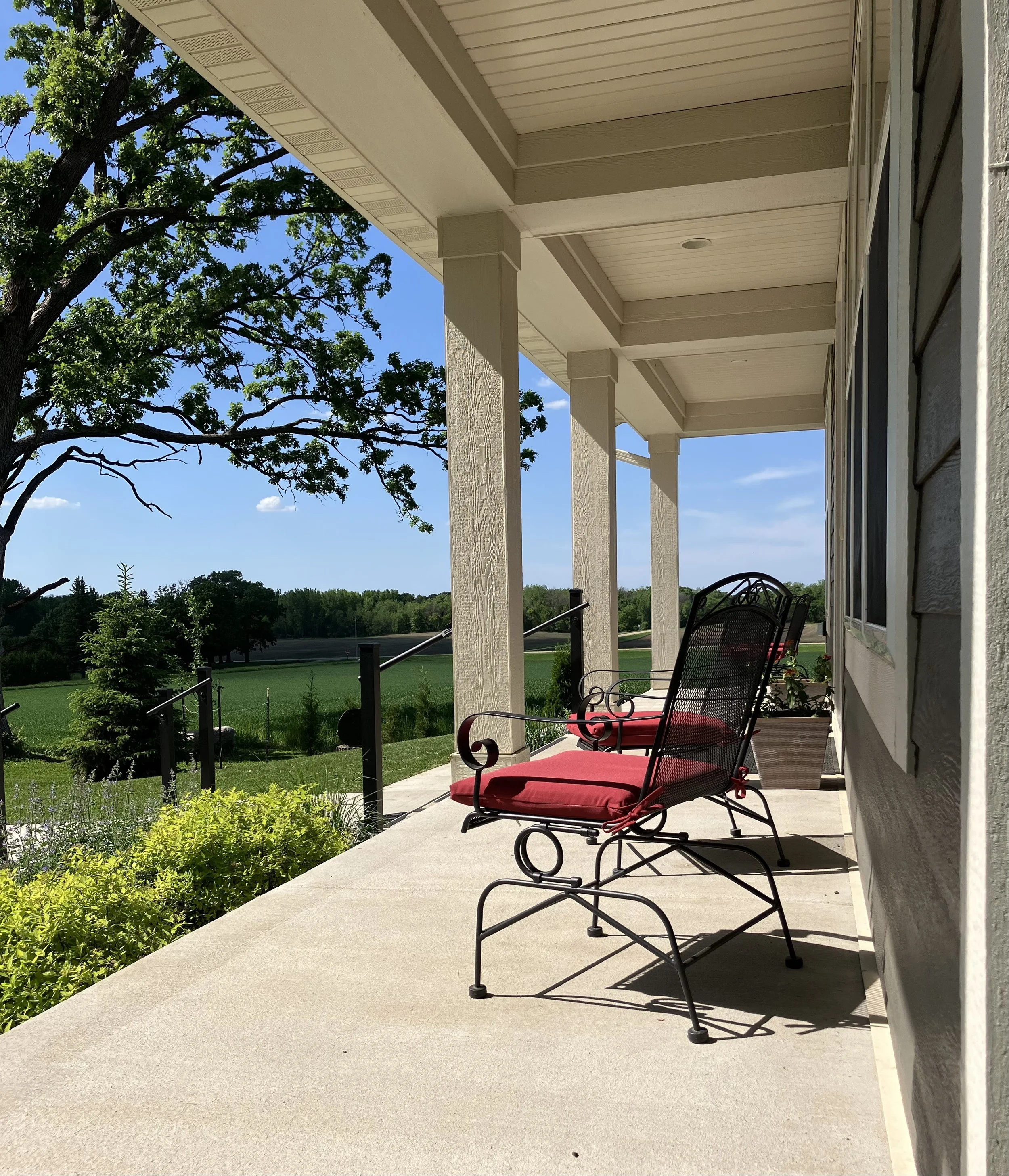chalet porch red chairs.jpeg