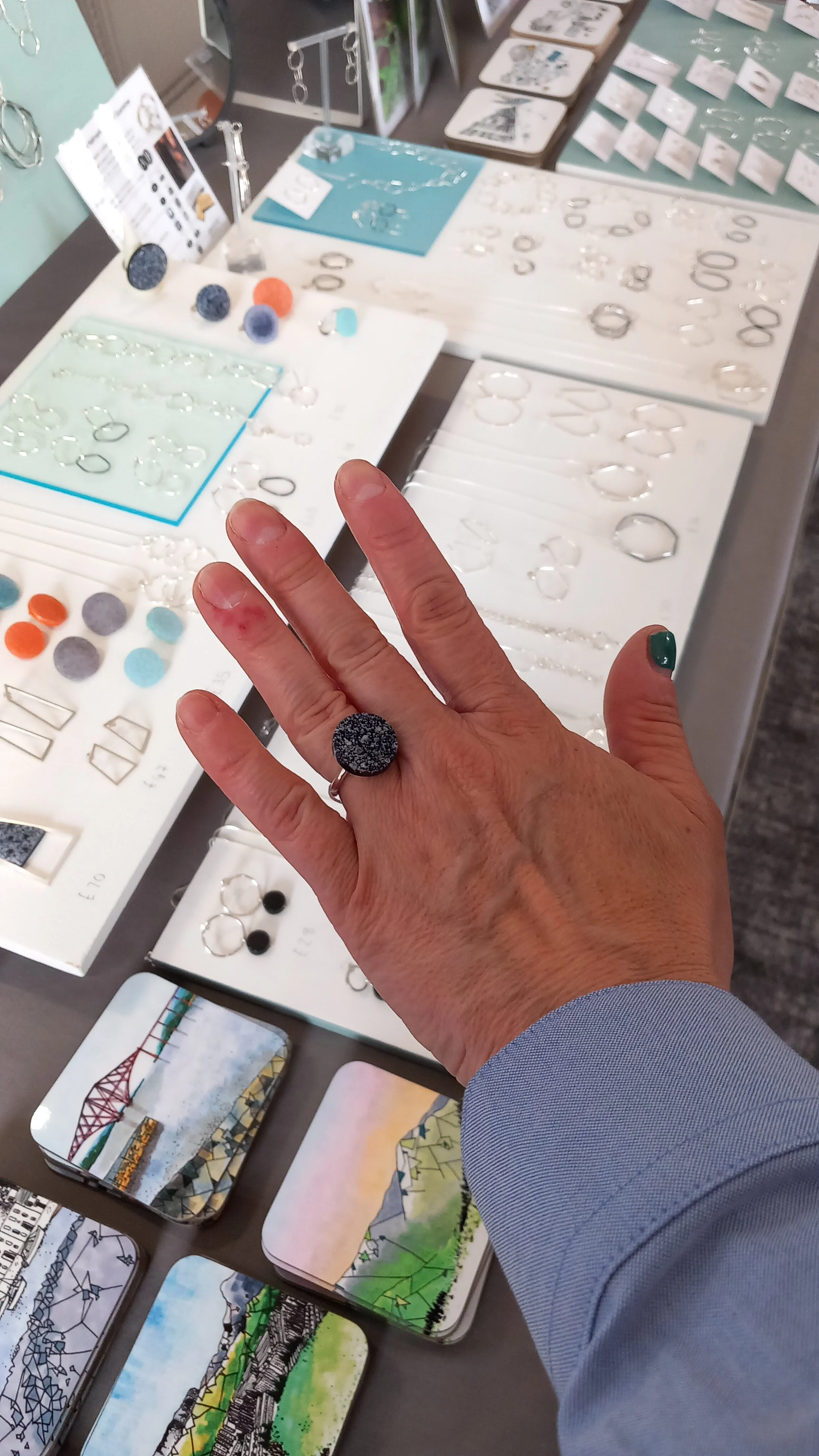 Customer choosing her ring, June