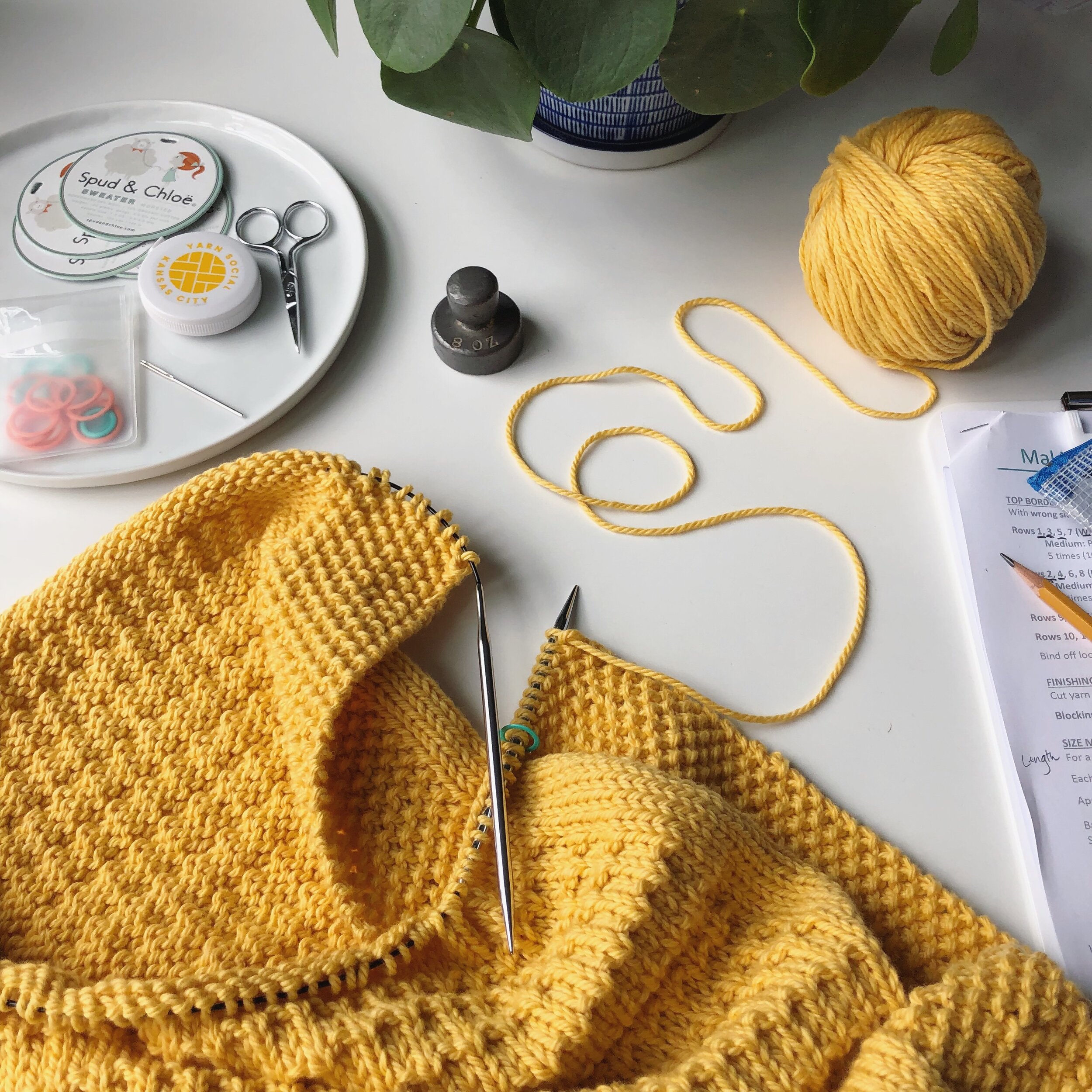 Use a pair of circular knitting needles to create round knit work.