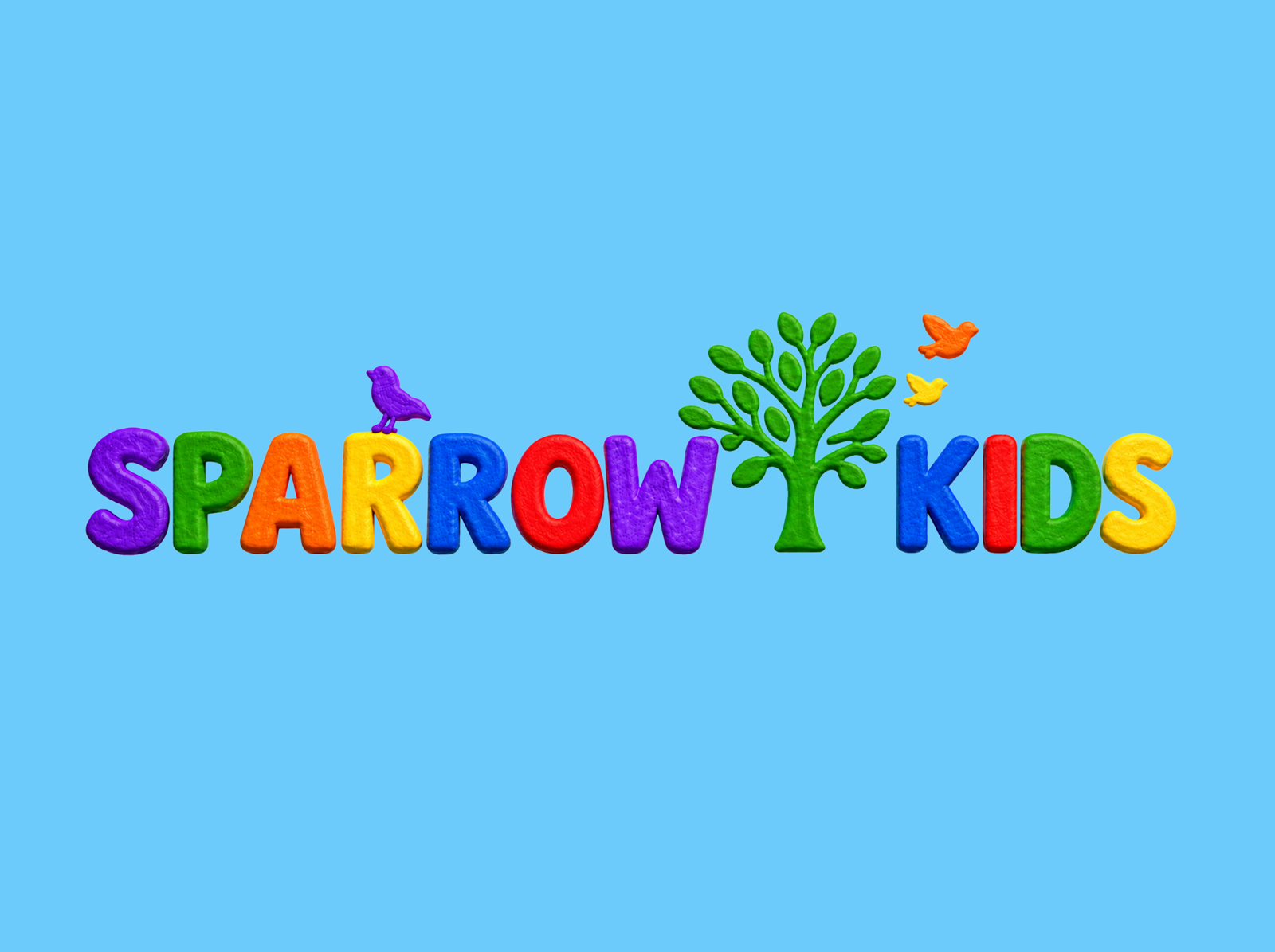 Colorful logo with the words "SPARROW KIDS" in bright, playful letters. The word "SPARROW" has a purple, green, orange, yellow, blue, and purple letters; the word "KIDS" has blue, red, green, and yellow letters. A small purple bird is perched on the letter "A" in "SPARROW," and three smaller birds (orange, yellow, and orange) are flying above the letter "K" in "KIDS." A green tree is between the words.