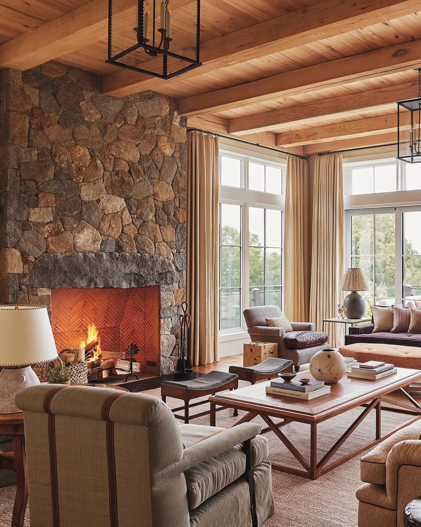 In the living room at our #LakeWaramaug project, &ldquo;pattern arrives in the form of @guygoodfellowcollection &lsquo;Fez Weave&rsquo;, which has been used to upholster the ottoman. Above it, two &lsquo;Zuma lanterns&rsquo; from @troylighting draw t