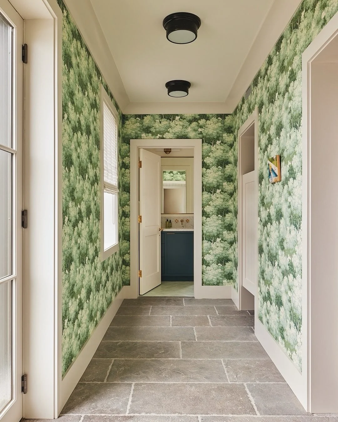 At our #LakeWaramaug project, in the lower-ground floor, a bright botanical wallpaper - &lsquo;Sherwood&rsquo; from @thomas.strahan - sets the tone for a less formal entertaining pool space. The custom lampshades in the changing room are in the same 