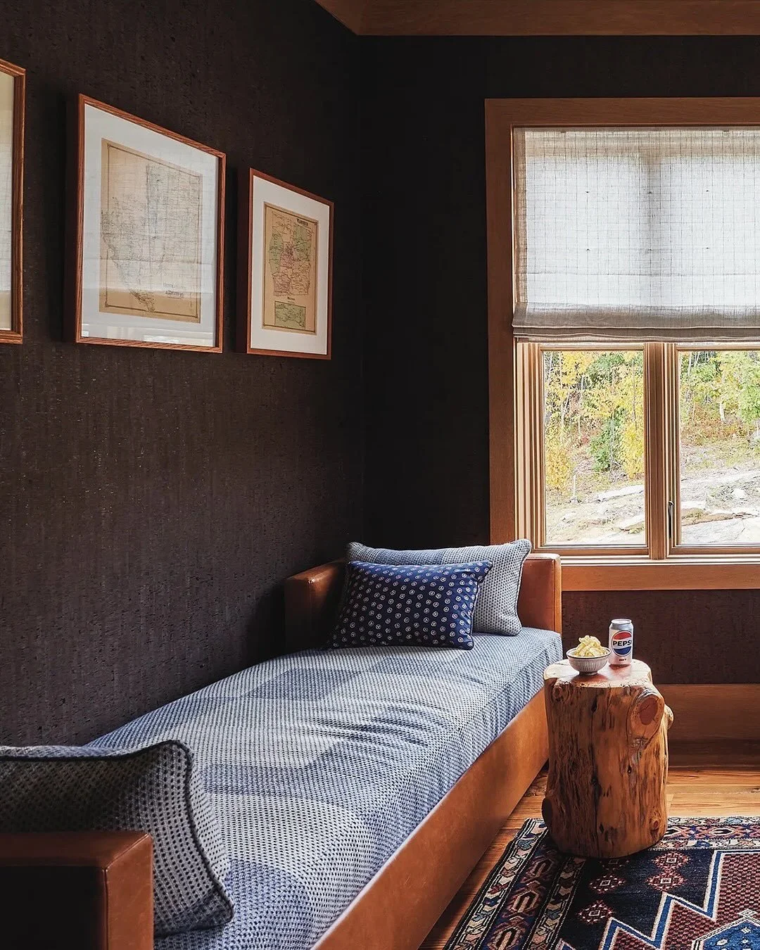 A custom daybed upholstered in a leather base and @zakandfox textile cushion along with cork walls complete this atmospheric study area. As featured in @houseandgardenuk. Photo: @katesjordan. Styling: @megleonard