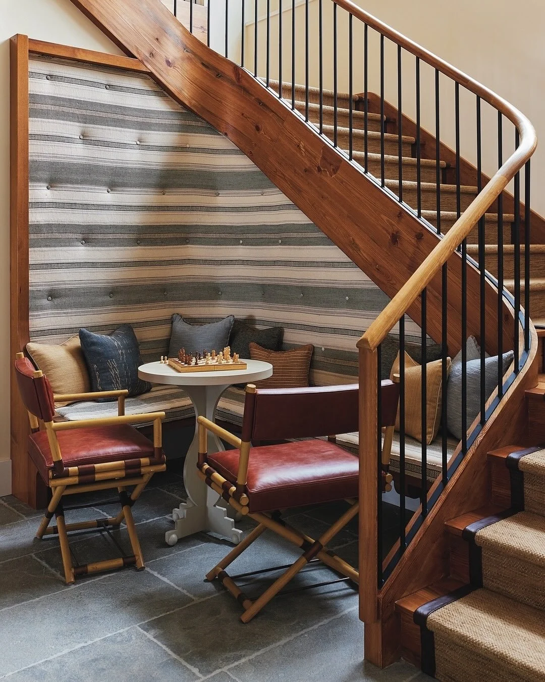 At our #LakeWaramaug project, we worked to make the most of every last detail, down to the small interstitial spaces and hallways. For the bottom of the staircase, we added a cozy banquet area for the occasional game or reading nook. As featured in @
