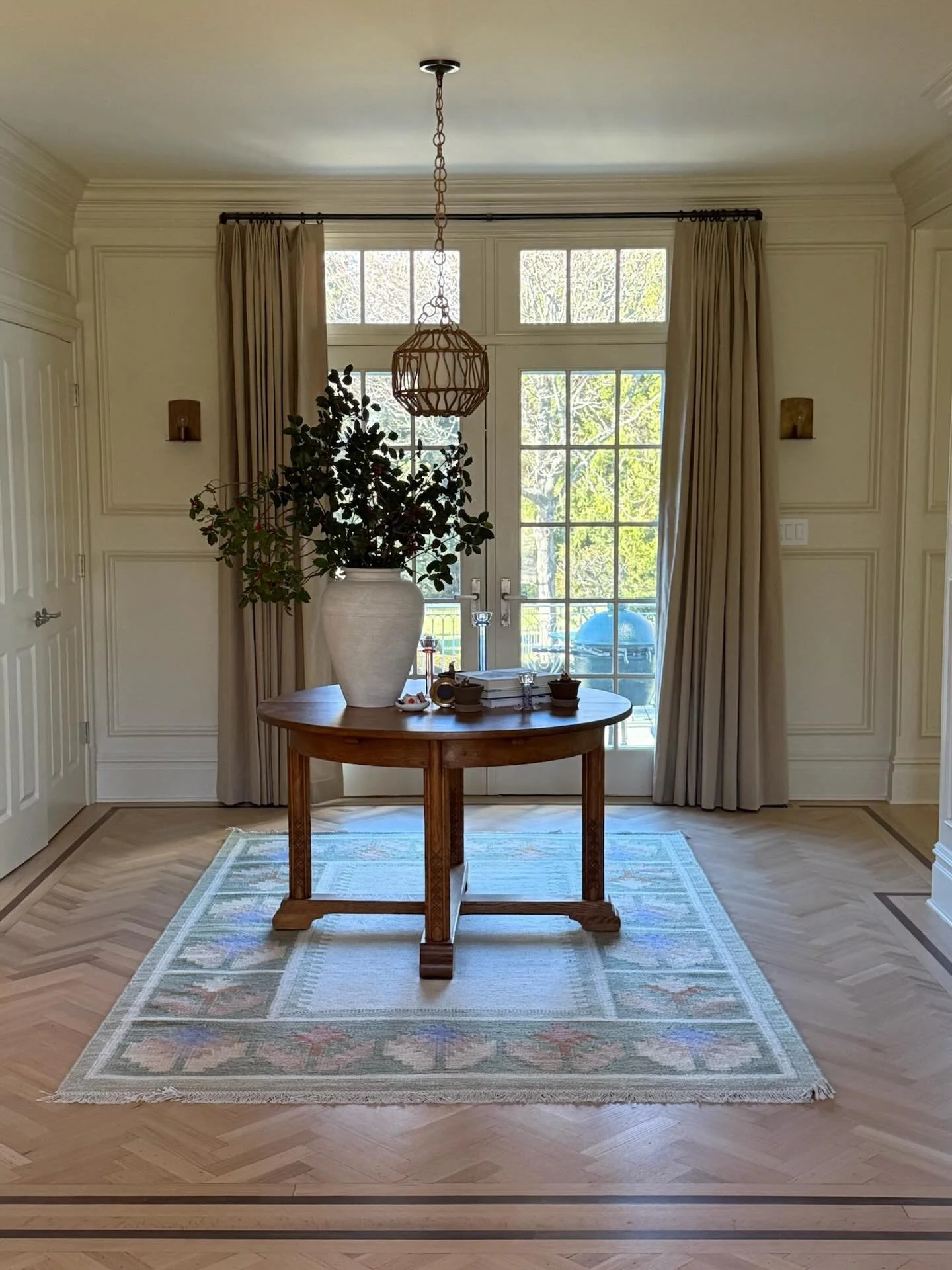 The stages of the entryway at our #Scarsdale project, featuring a 1940s hand-carved center table we sourced for our clients all the way from Amsterdam. It was made by Anton Fortuin who designed and manufactured it for his own home. #ninacarbone