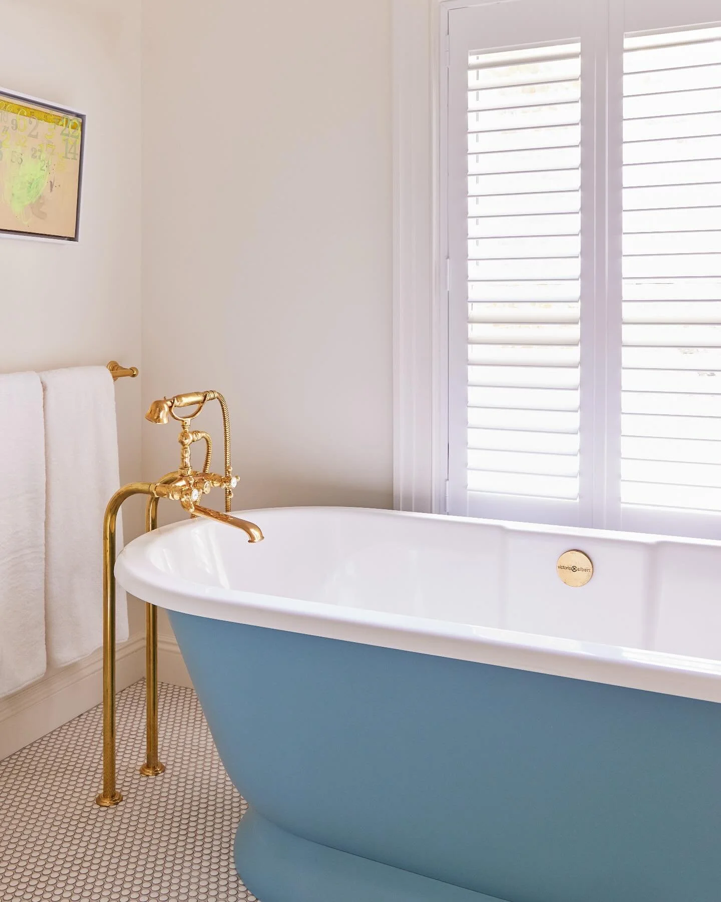 At our #Greenwich project, we designed the daughter&rsquo;s bath with have neutral finishes in order to allow this custom-color blue tub to really have its moment. #ninacarbone
