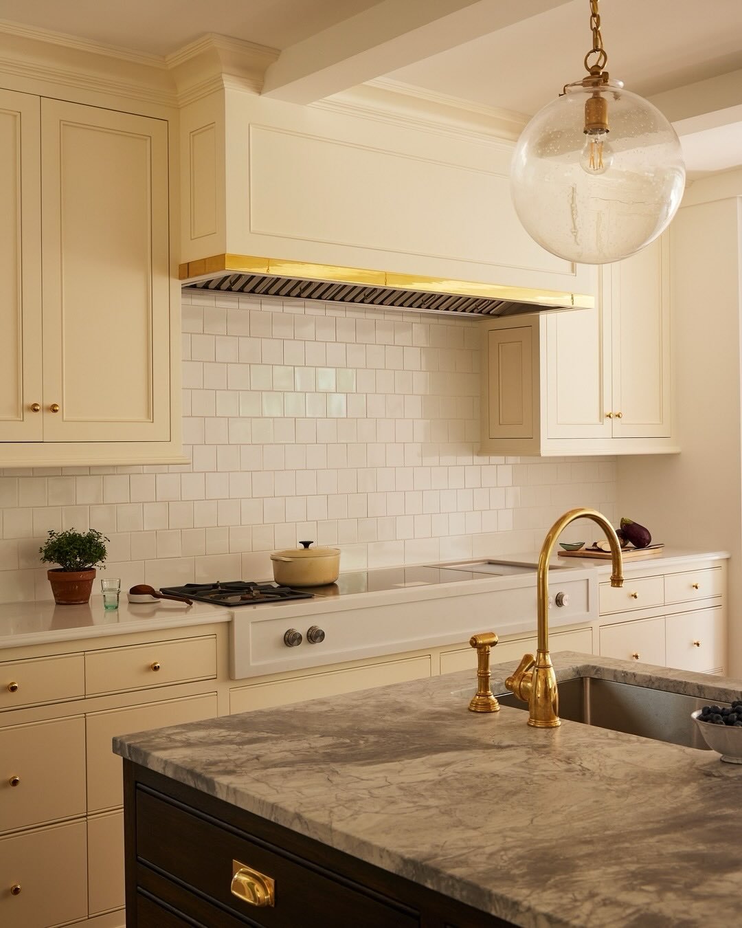 To add a little bit of personality to the primarily white kitchen at our #Greenwich project, we injected a dose of color and playfulness via the pantry swing door &mdash; swipe to see it. Photo: @katesjordan. Styling: @megleonard #ninacarbone