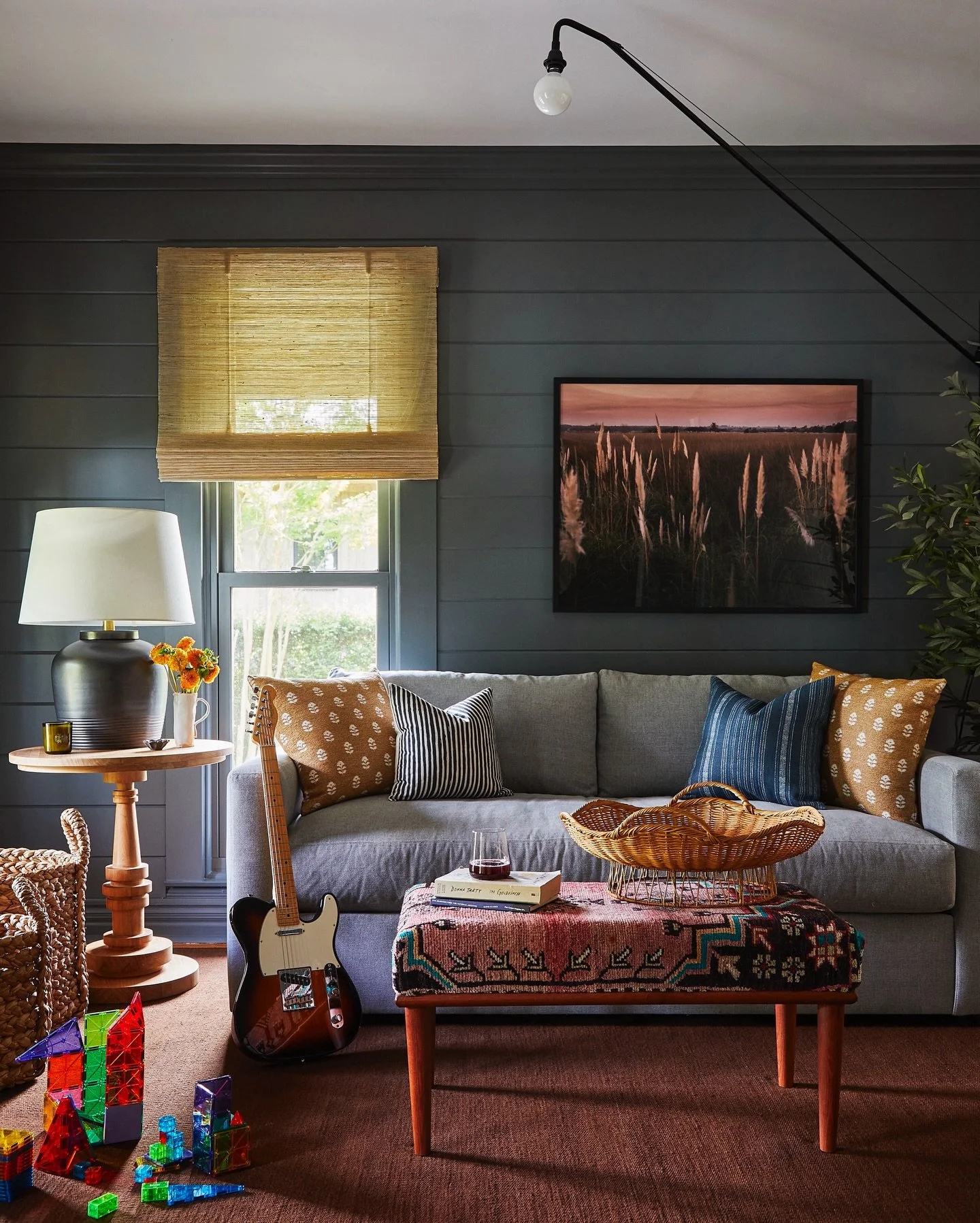 For the den at our #Greenport project, we added horizontal v-groove paneling and went dark on the paint to create a casual and kid-focused space. Photo: @katesjordan