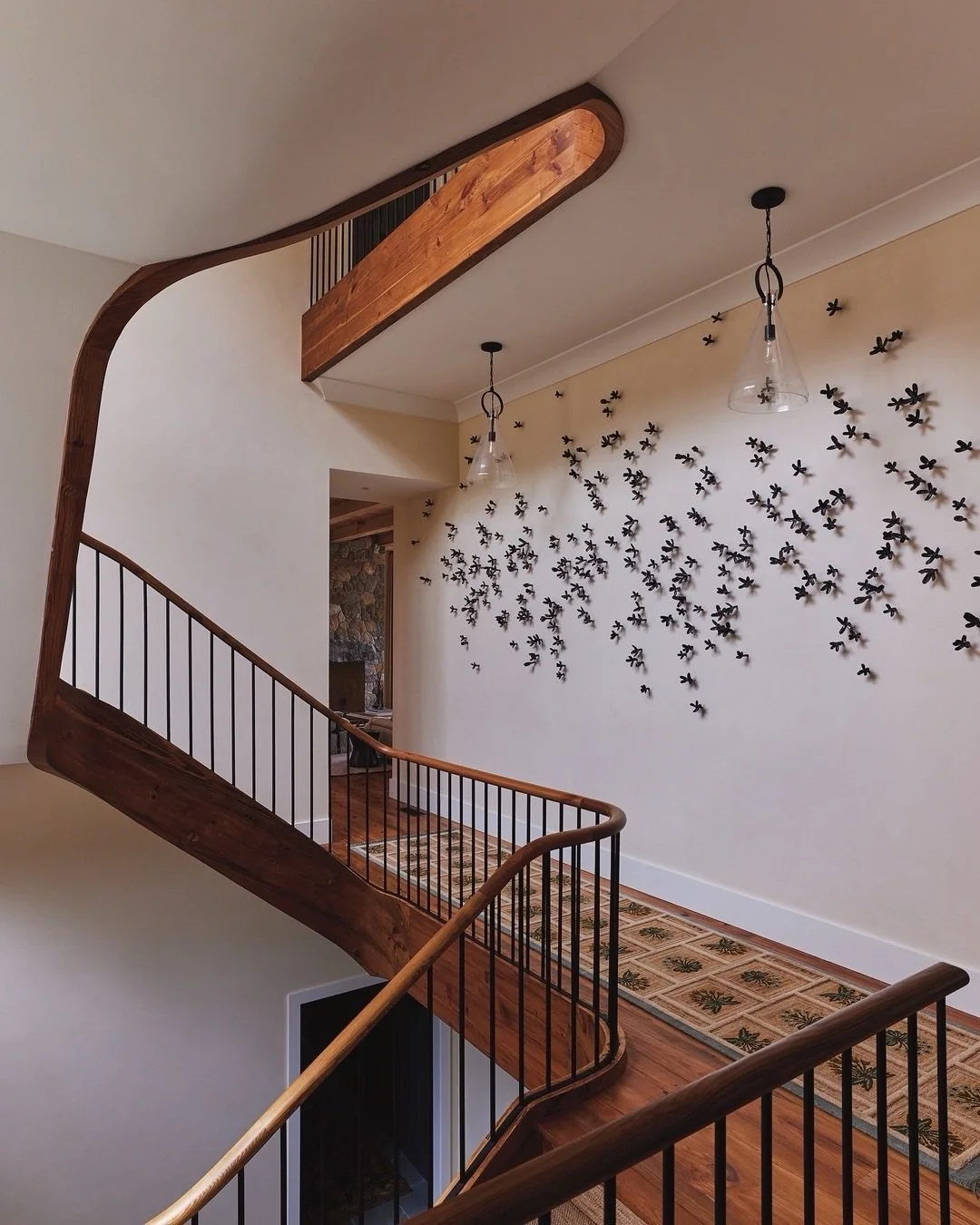 The staircase at our #LakeWaramaug project was a big wow-factor for the space. For the main floor landing, it was important to find something that filled the expansive space, but wasn&rsquo;t overpowering in the hallway. We worked with artist Bradley