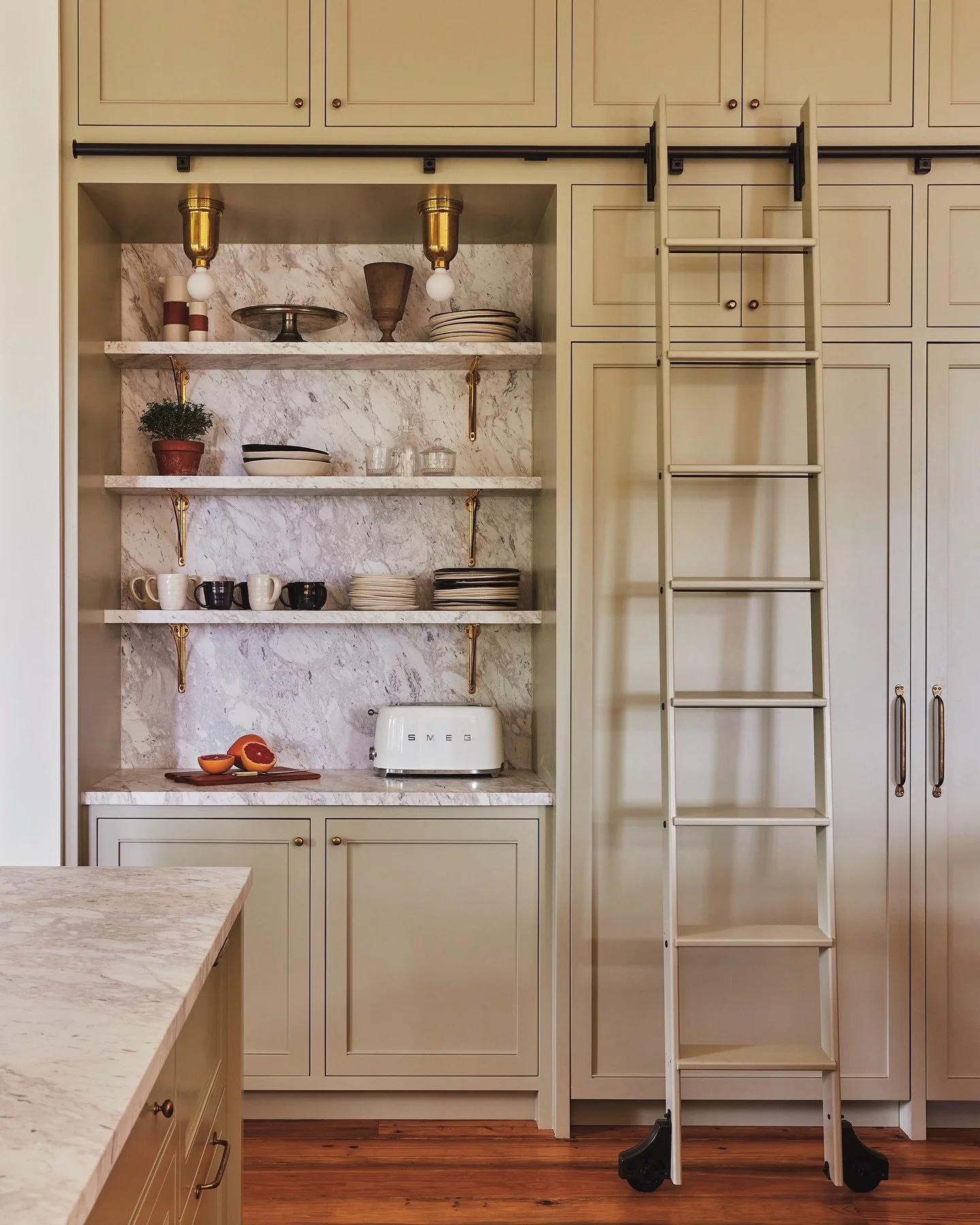In our opinion, every kitchen should have a ladder. At our #LakeWaramaug project, we specified an English shaker-inspired kitchen, swathed in Farrow &amp; Ball&rsquo;s &lsquo;French Gray&rsquo;. Above the island hang &lsquo;Eddystone Pendants&rsquo; 